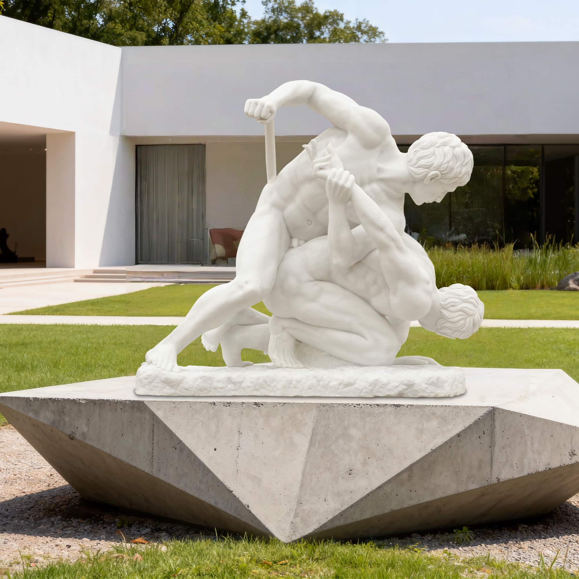 Outdoor installation of The Wrestlers marble statue replica displayed on modern pedestal in garden setting.