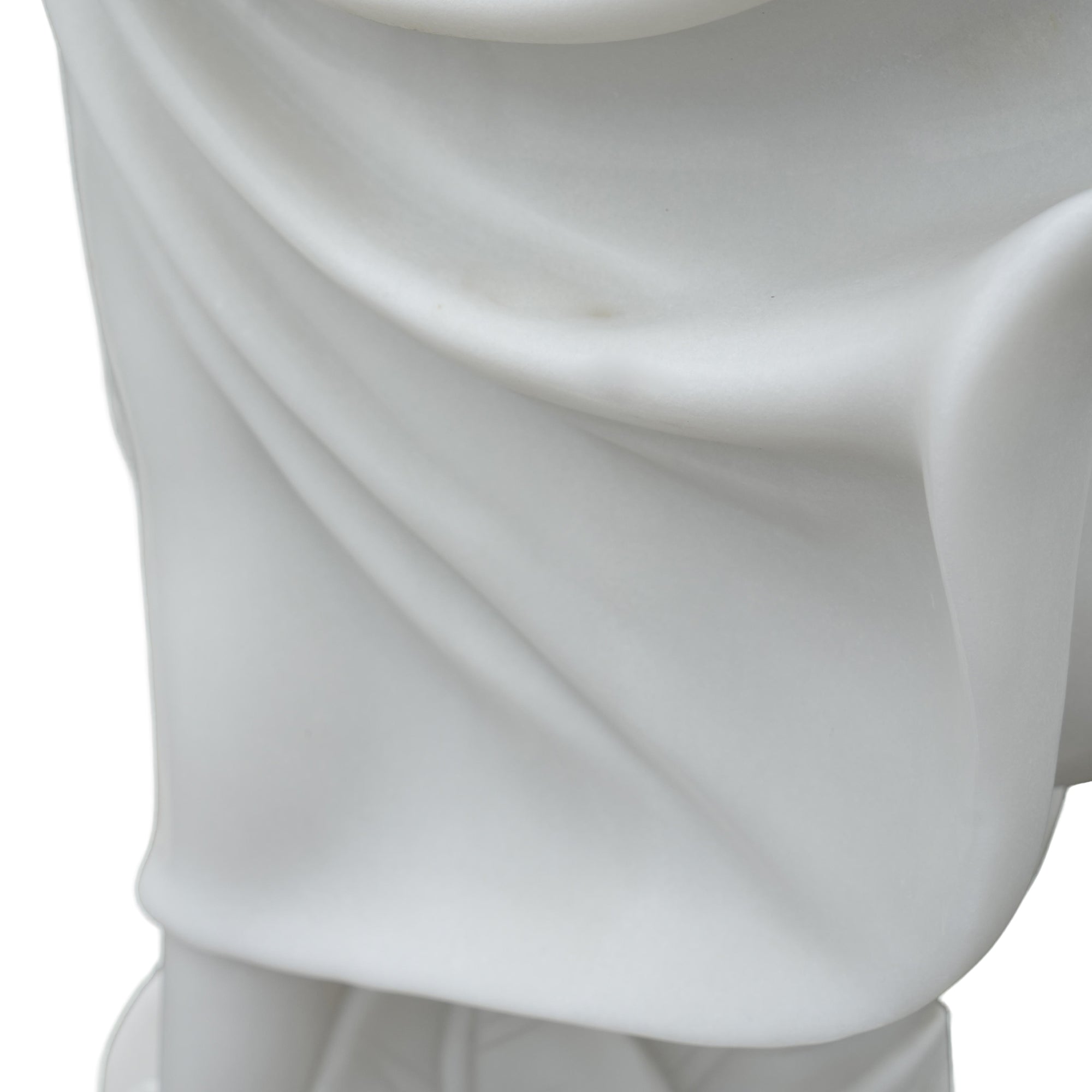 Close-up of flowing drapery detail on marble dancer sculpture showcasing fine hand-carved folds and smooth craftsmanship.