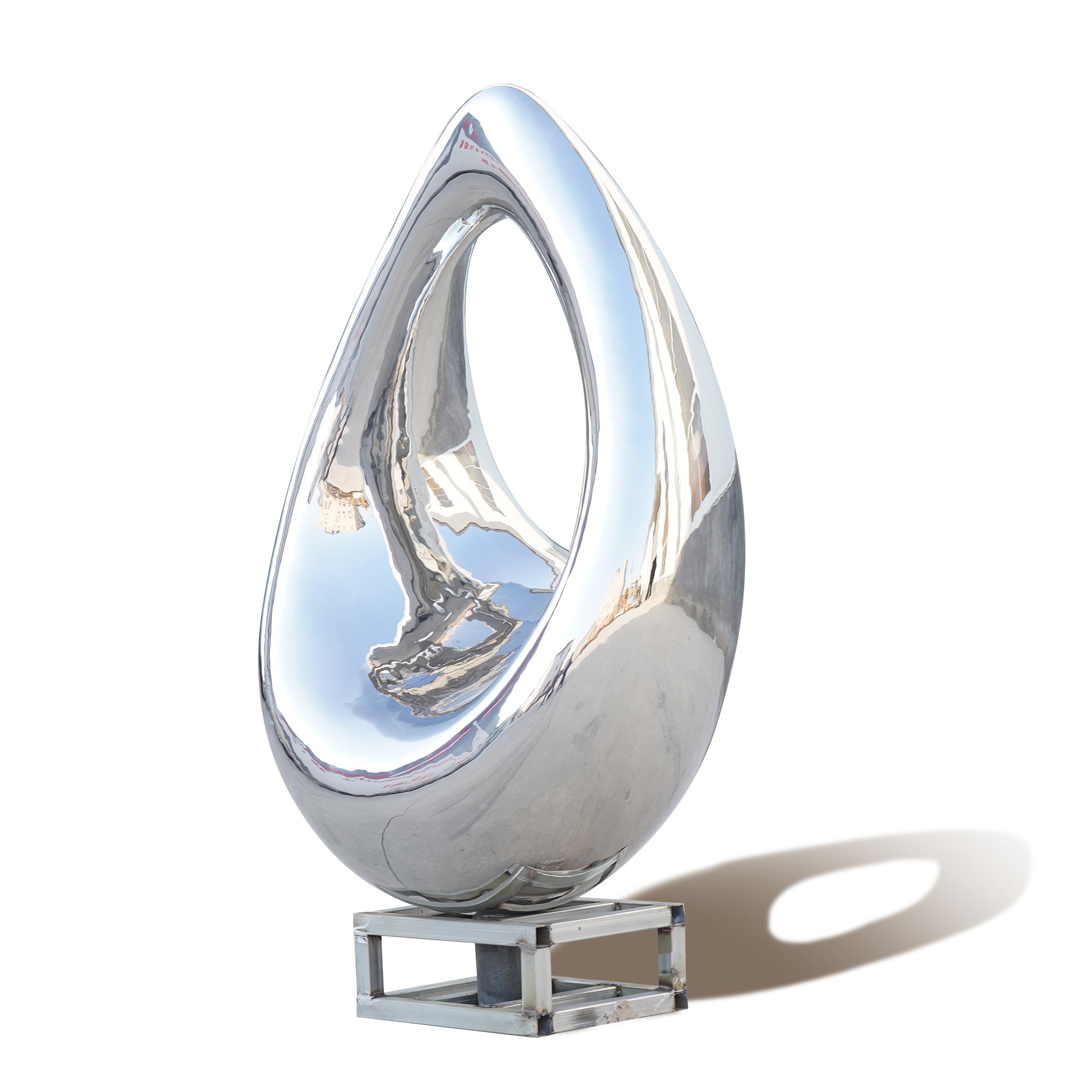 stainless steel teardrop-shaped sculpture on a white background
