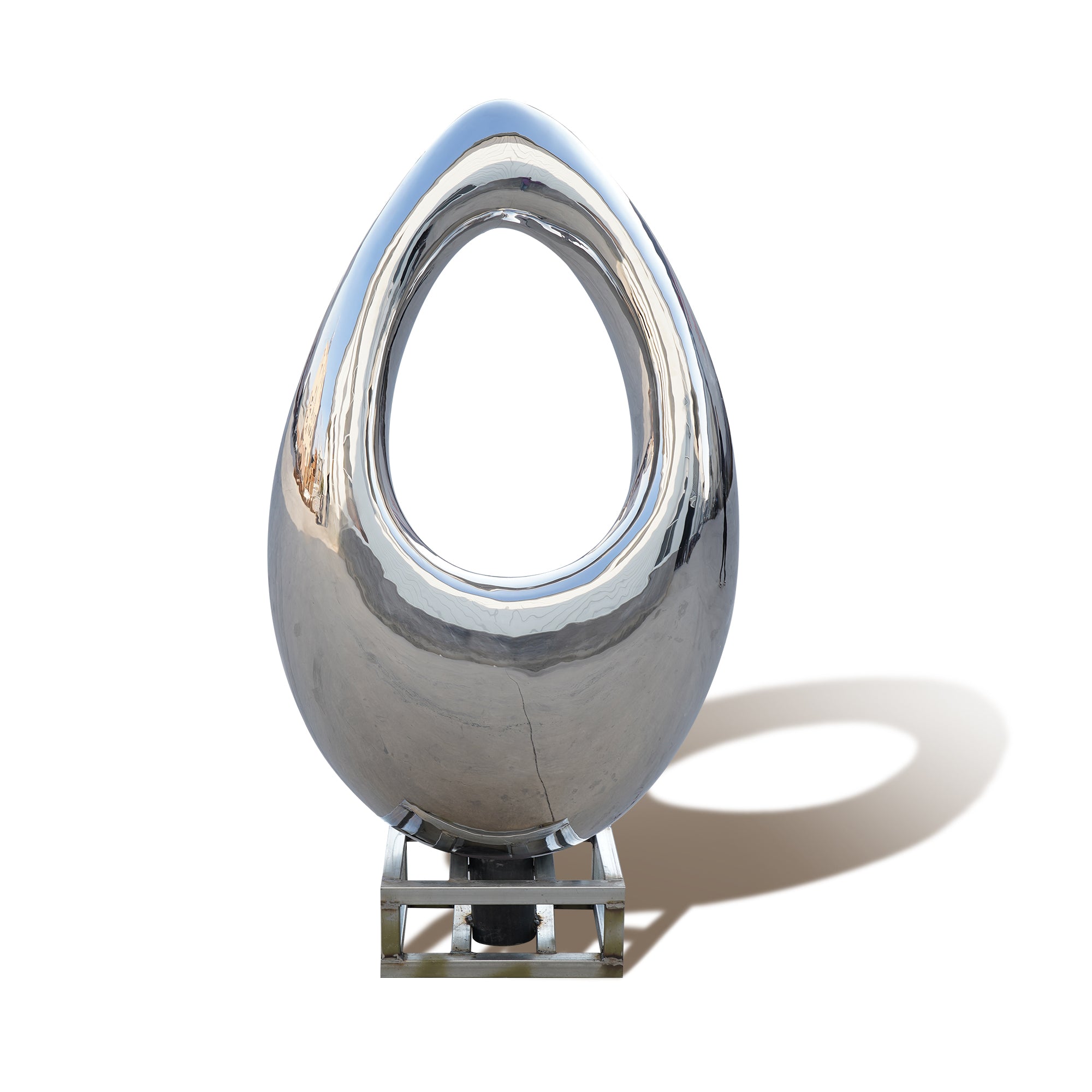 stainless steel teardrop-shaped sculpture on a white background