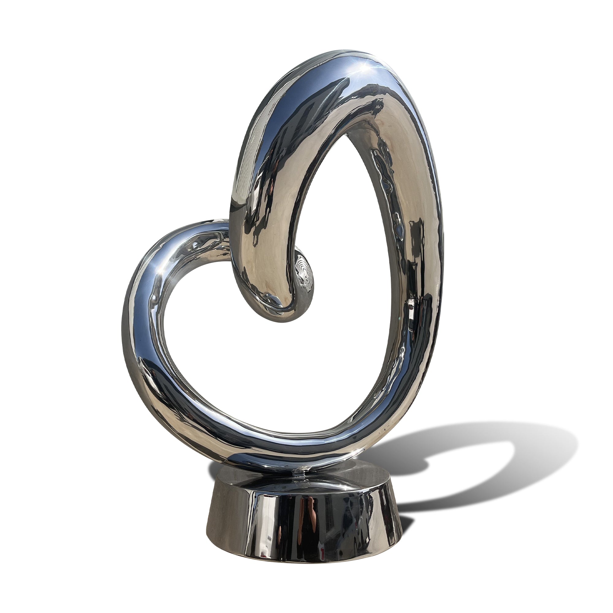 mirror finish stainless steel heart sculpture with a swirling design on a white background