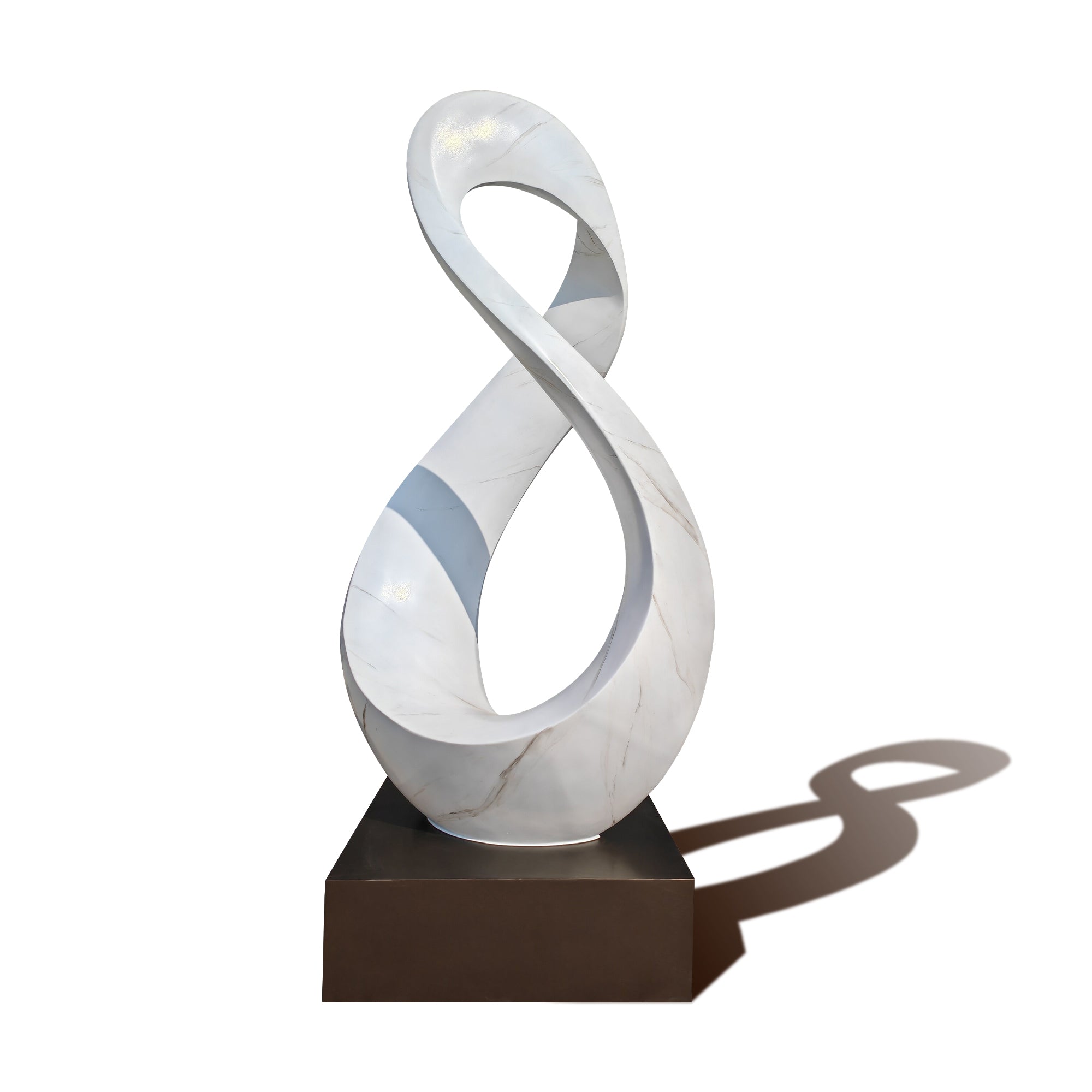 Abstract sculpture with a white and gray design on a brown base against a white background