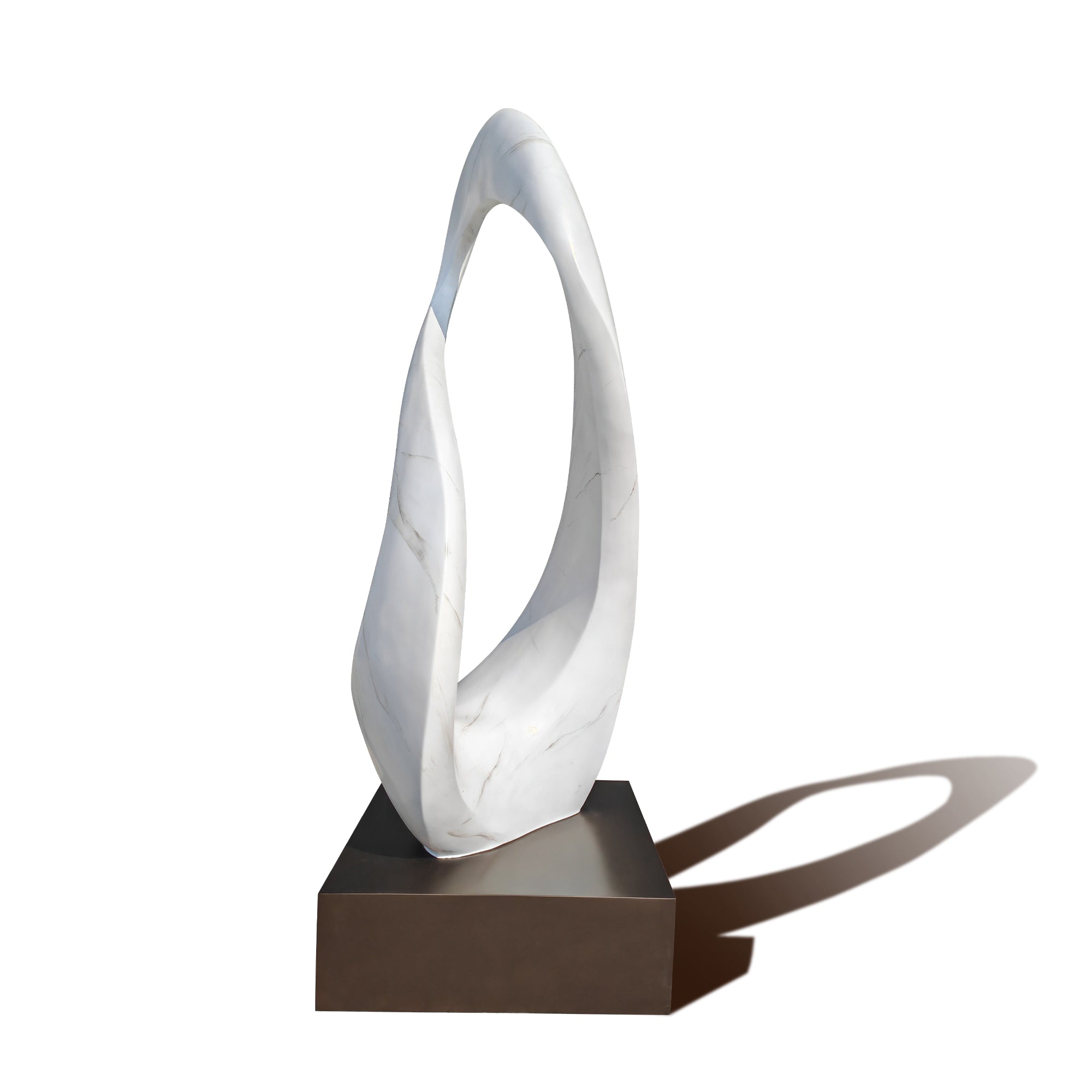 Abstract sculpture with a white marbled design on a brown base against a white background