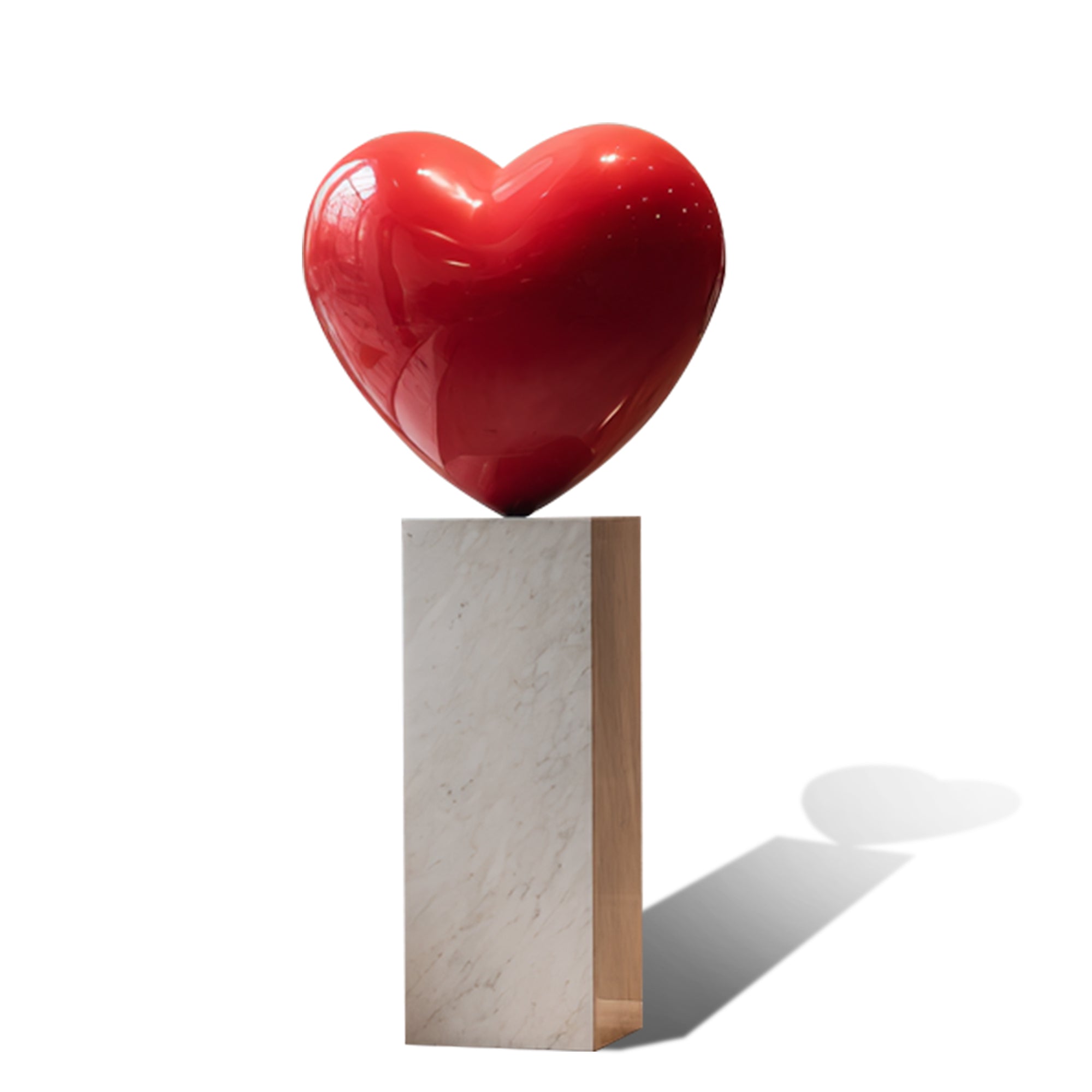 Red heart-shaped stainless steel sculpture on a white pedestal with a white background
