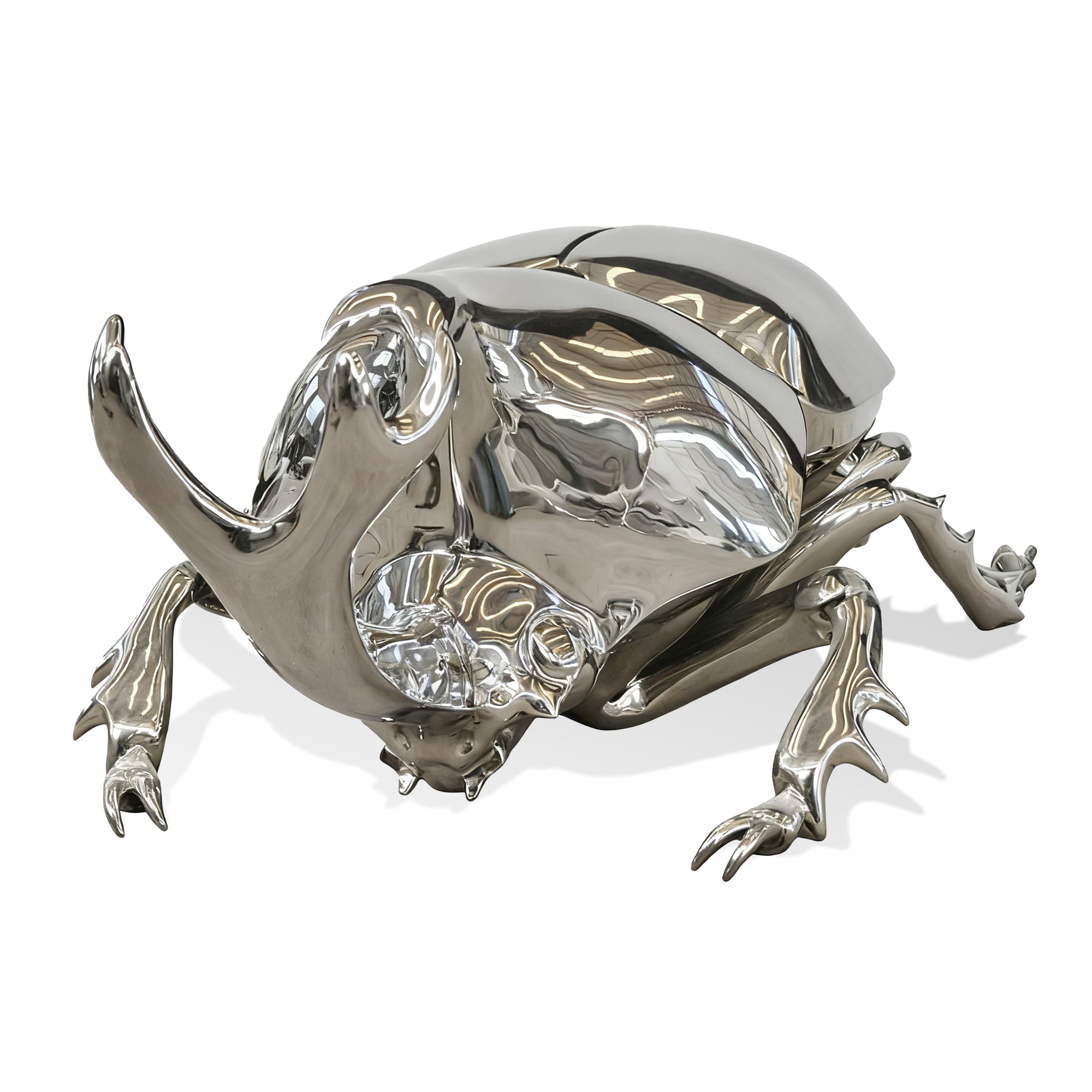 Silver beetle figurine on a white background