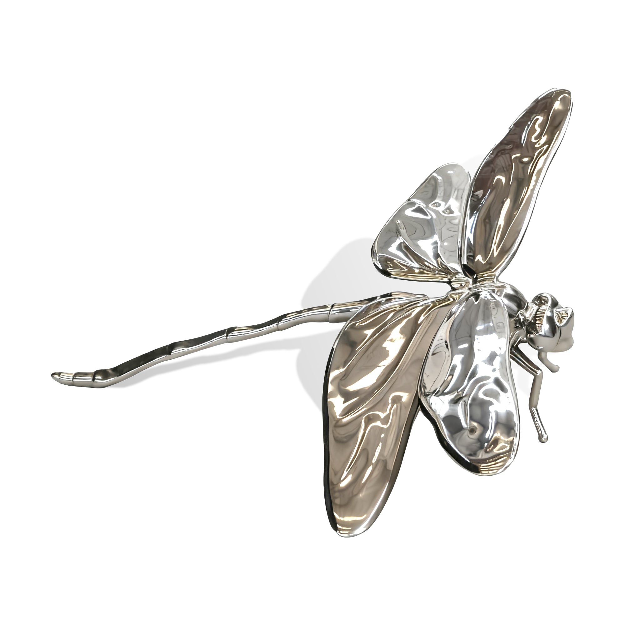 Silver dragonfly-shaped hair clip on a white background