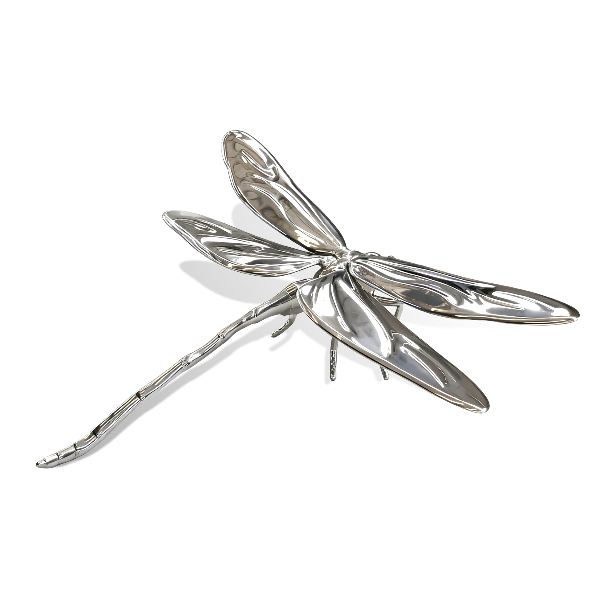 stainless steel dragonfly-shaped object on a white background