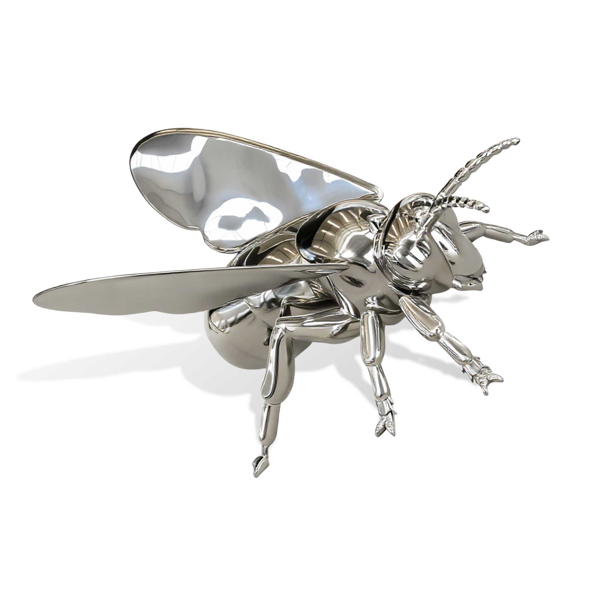 stainless steel bee sculpture on a white background