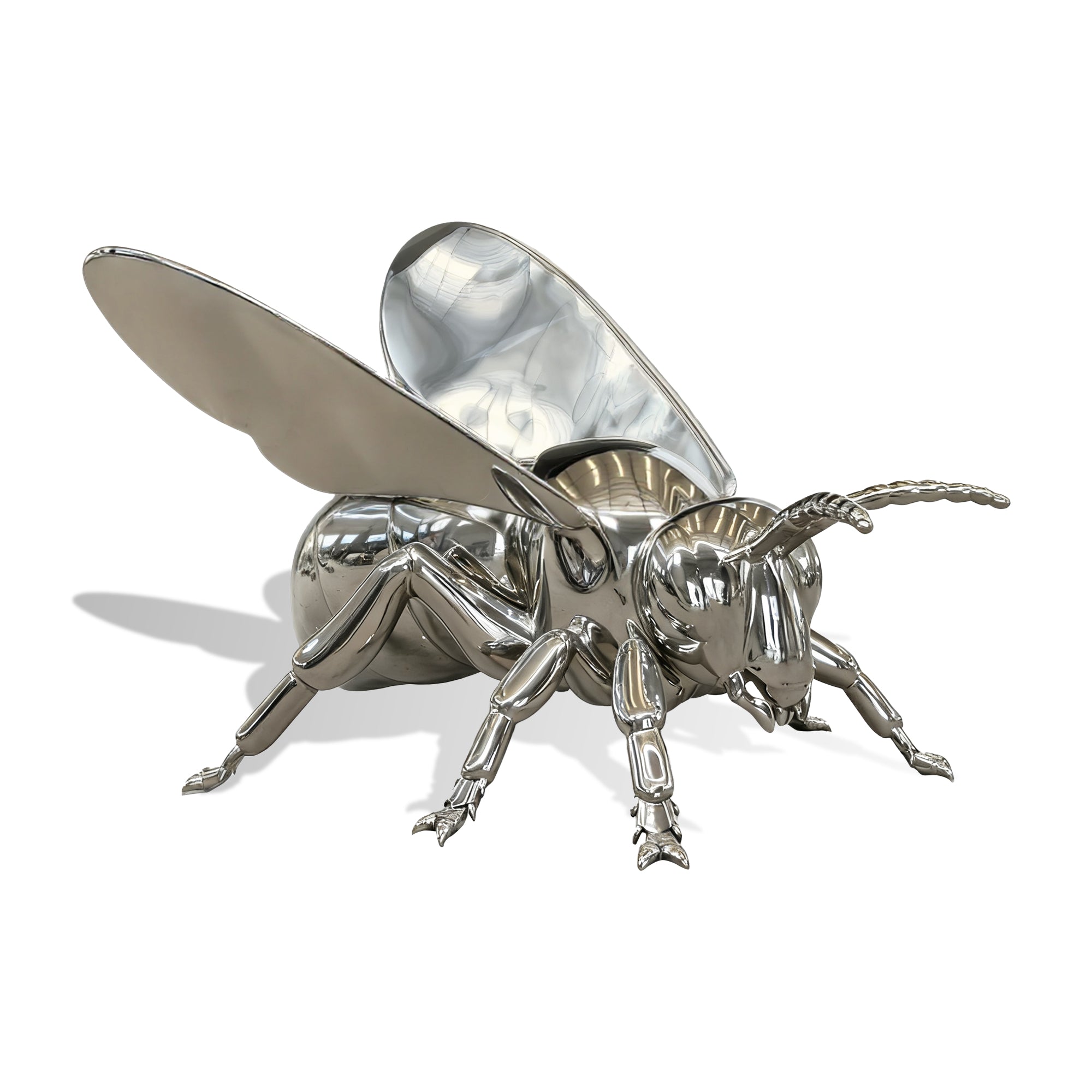 stainless steel bee sculpture on a white background