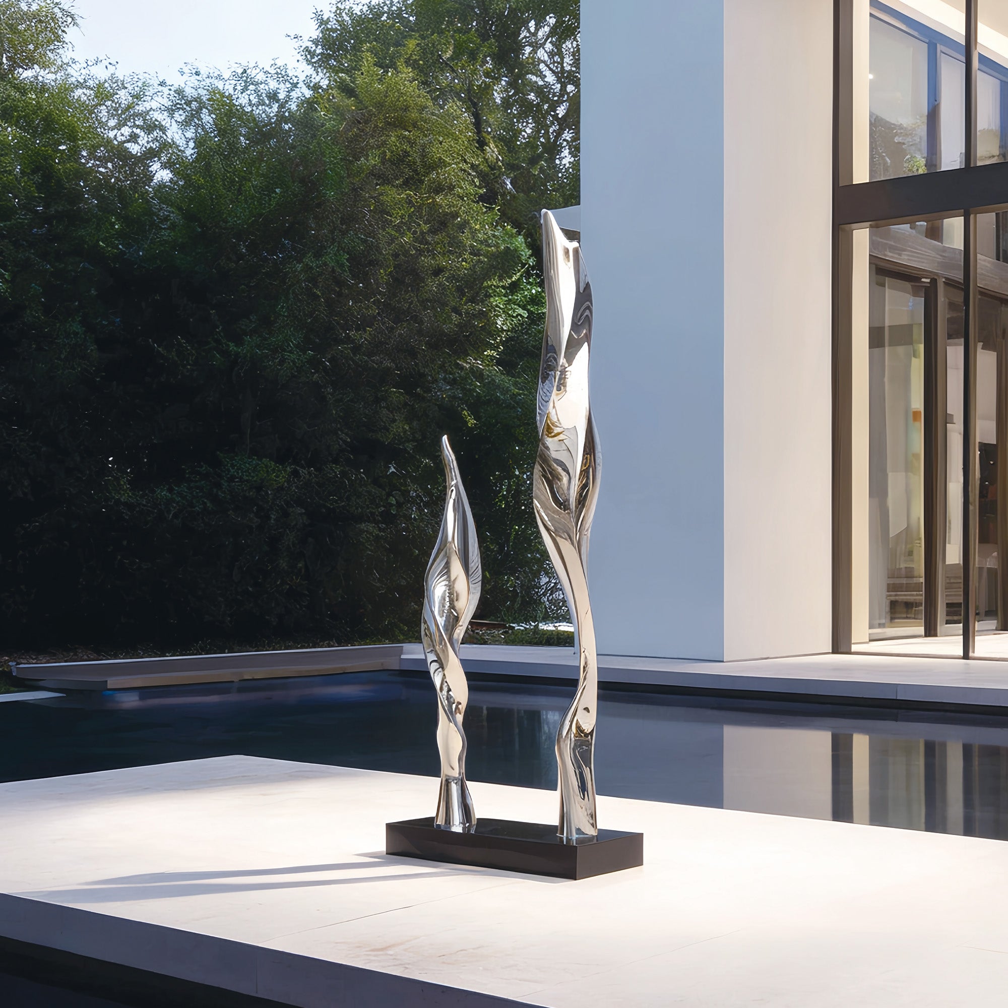 A striking mirror-polished sculpture placed at the entrance of a modern estate, reflecting the surrounding architecture and nature, adding a touch of sophistication.