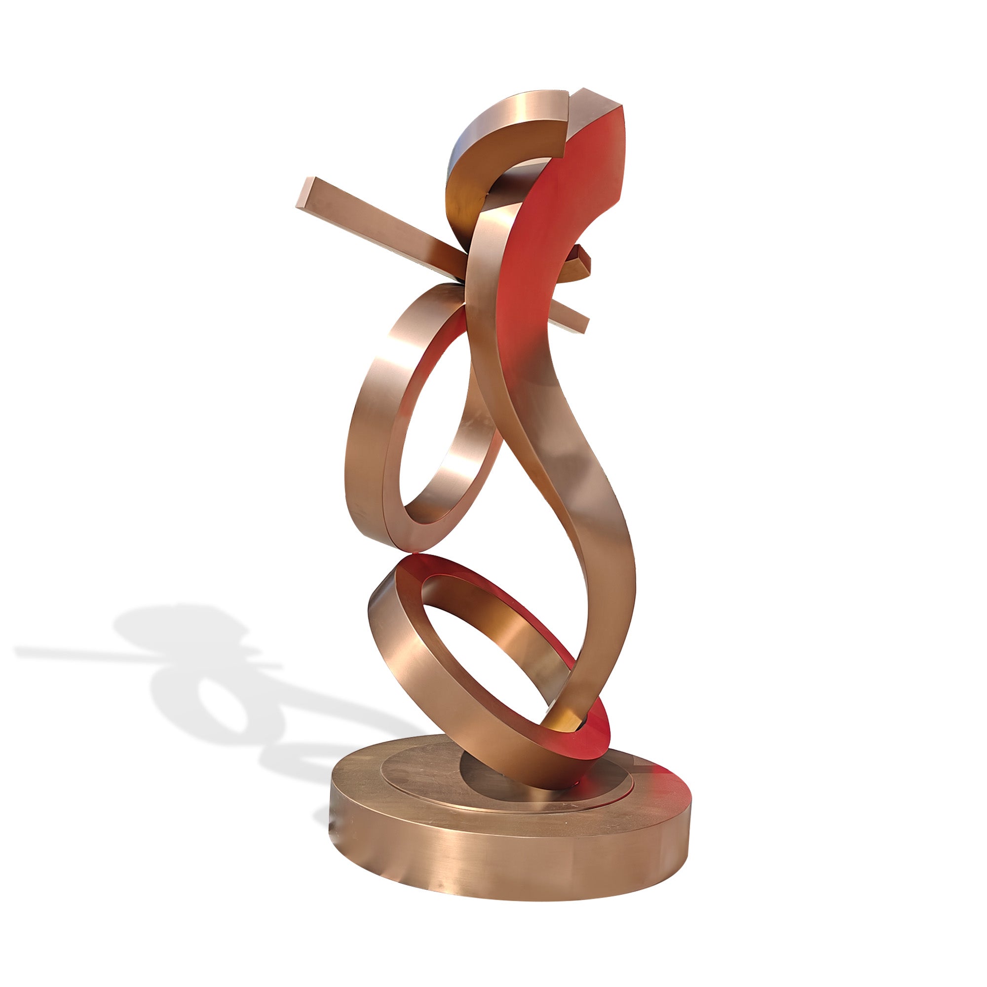 Side view of rose gold hairline stainless steel abstract ribbon sculpture with circular forms, custom indoor art for upscale spaces, white background.