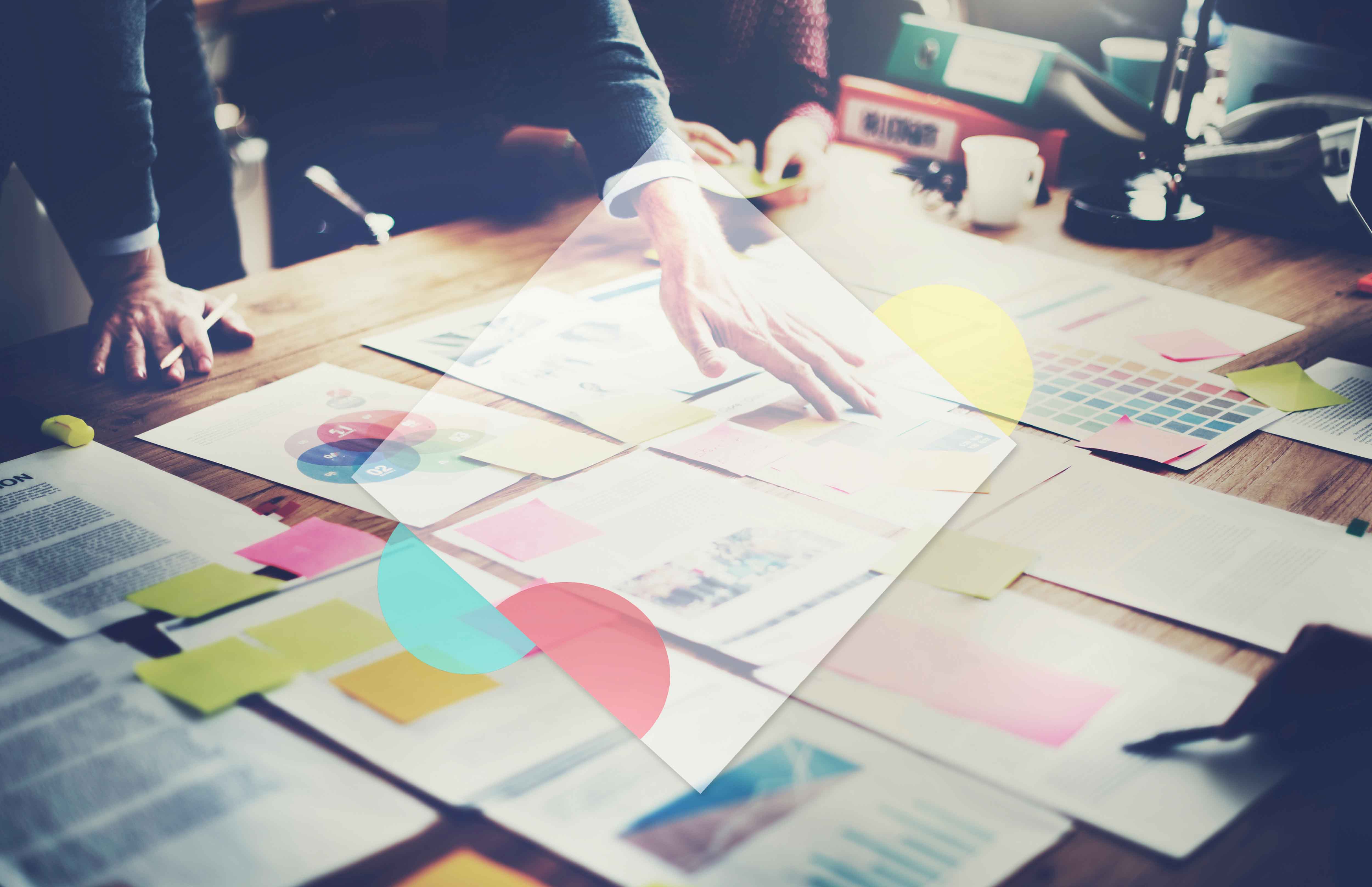 team members design sculpture on a desk