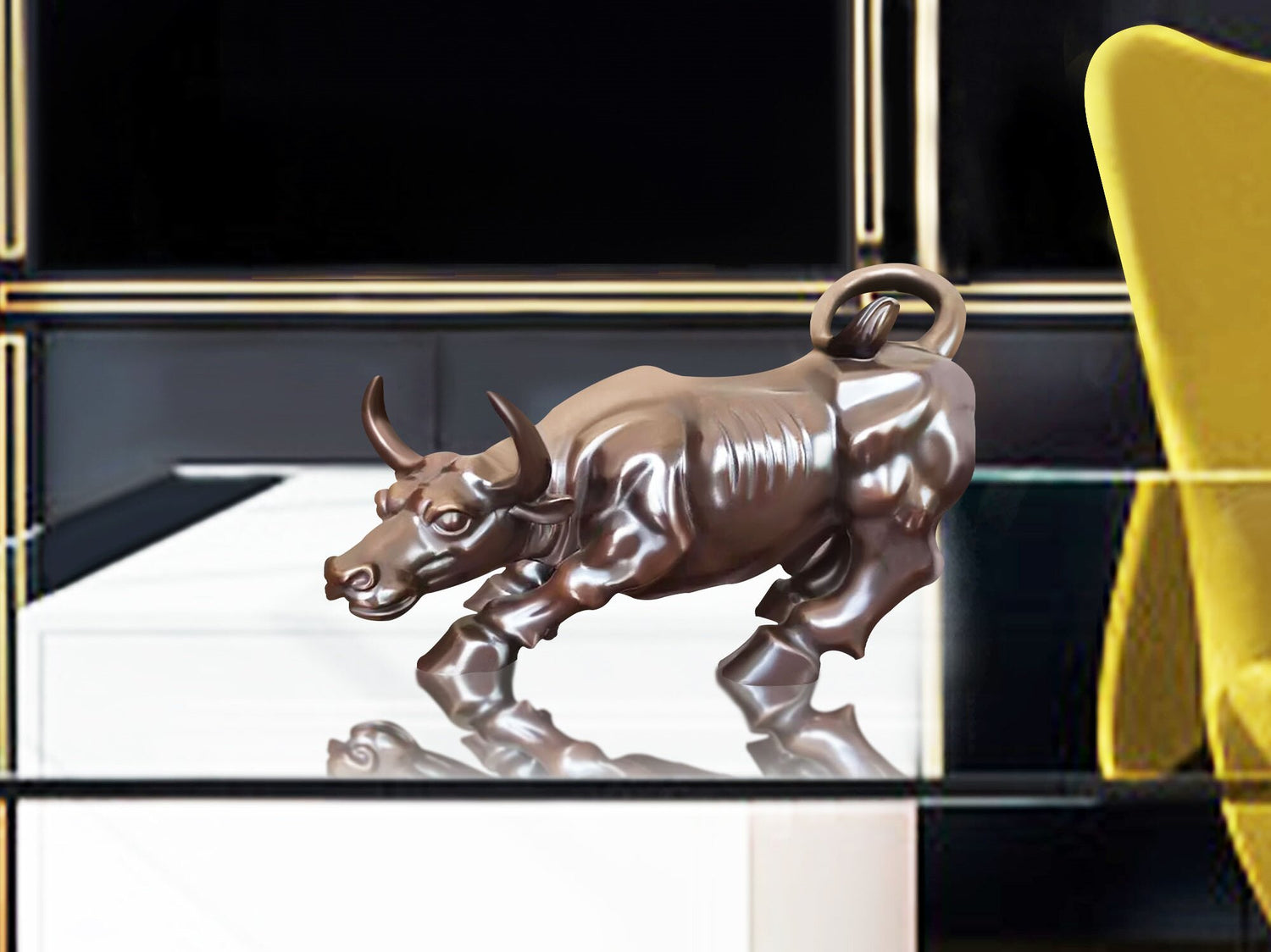 bronze charging bull sculpture on the glass table