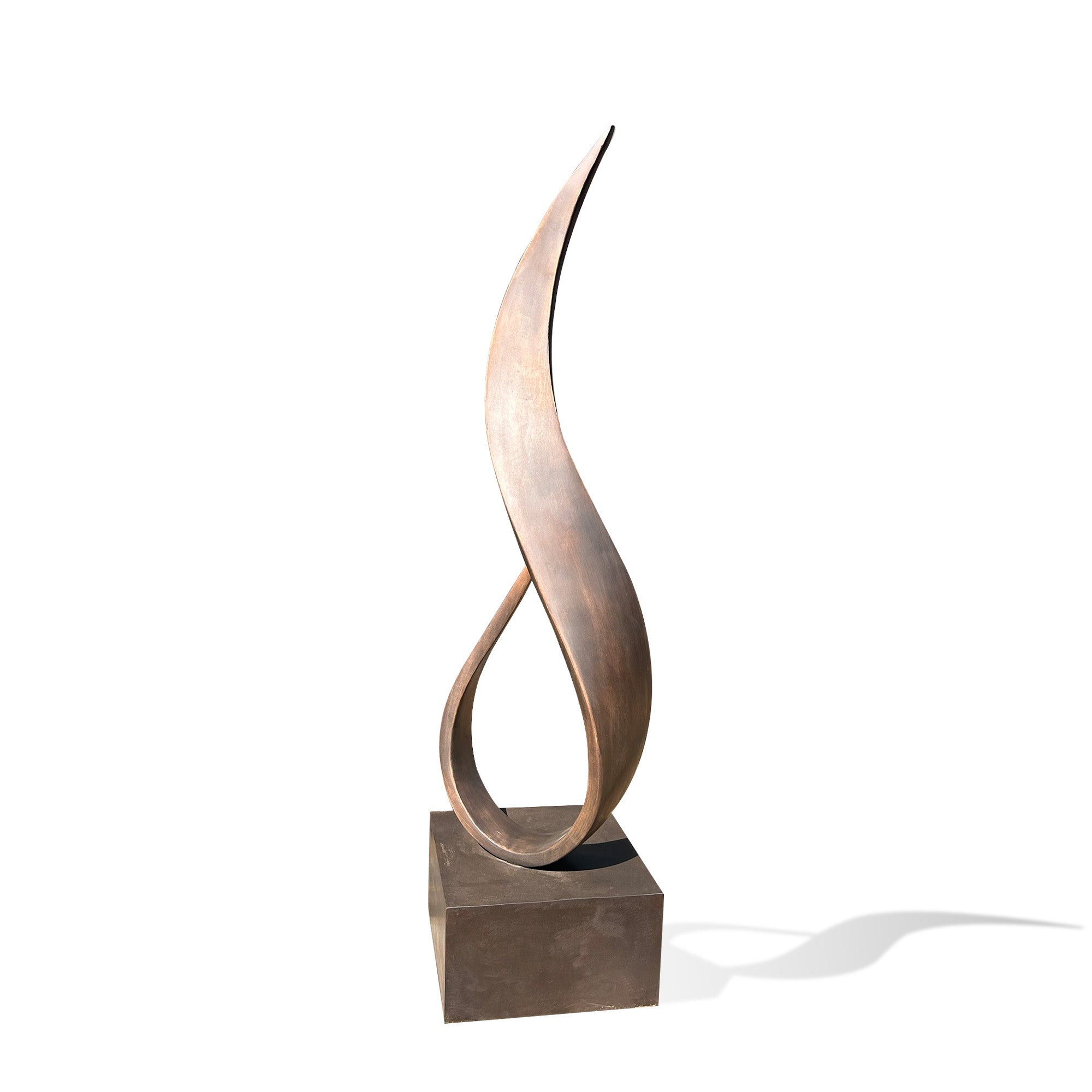 Abstract sculpture with curved design on a white background