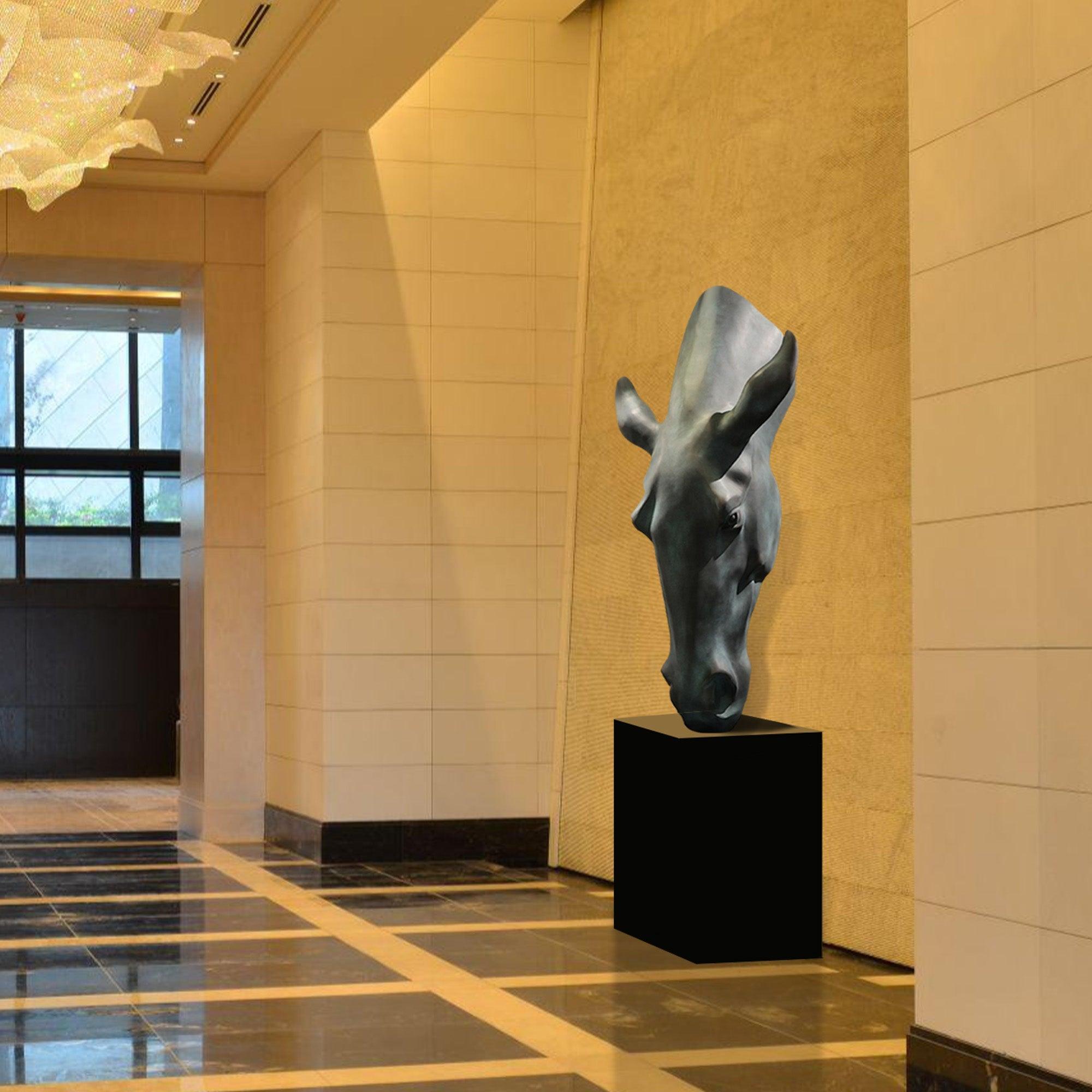 dark grey horse head bronze sculpture in a hotel lobby