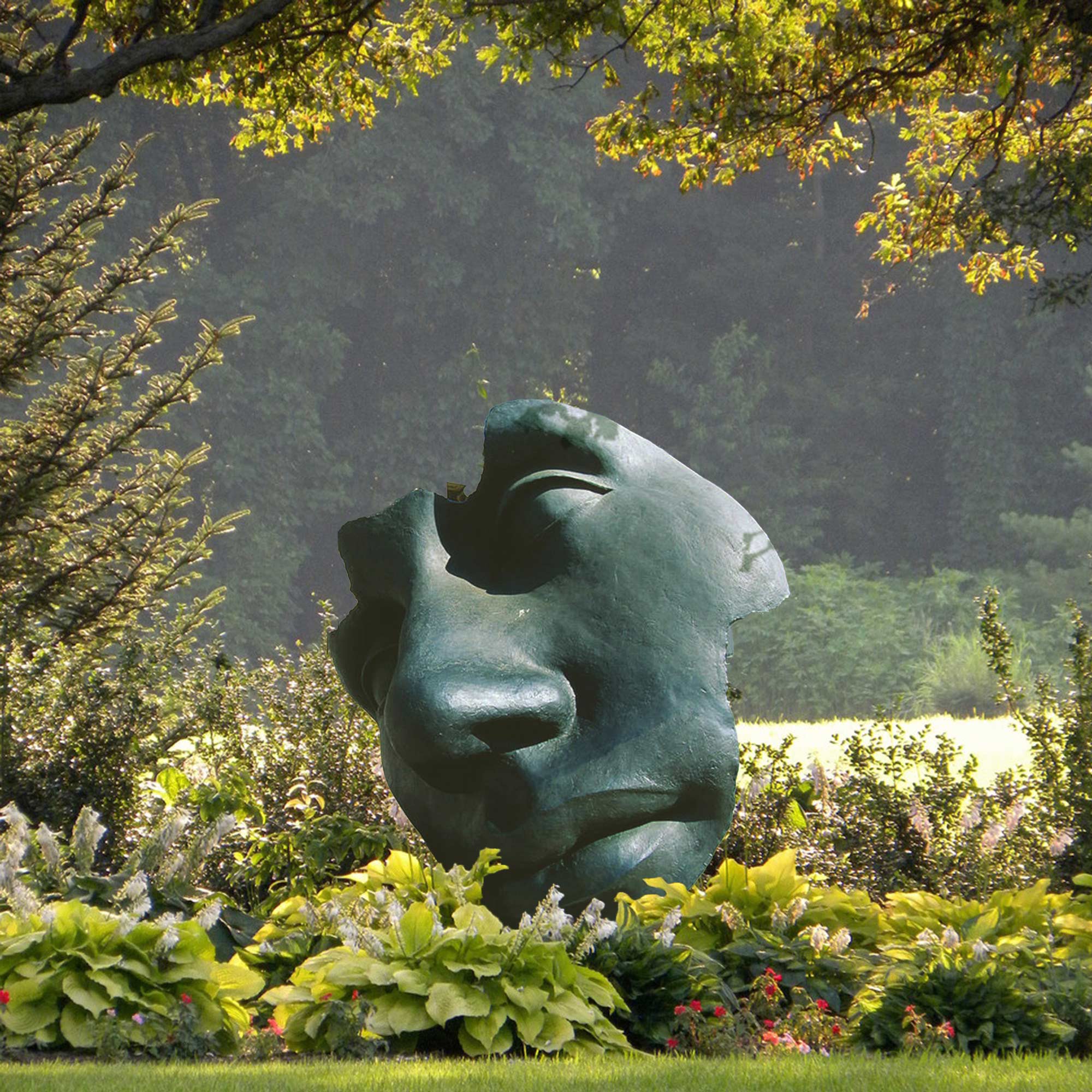 bronze abstract face sculpture in garden