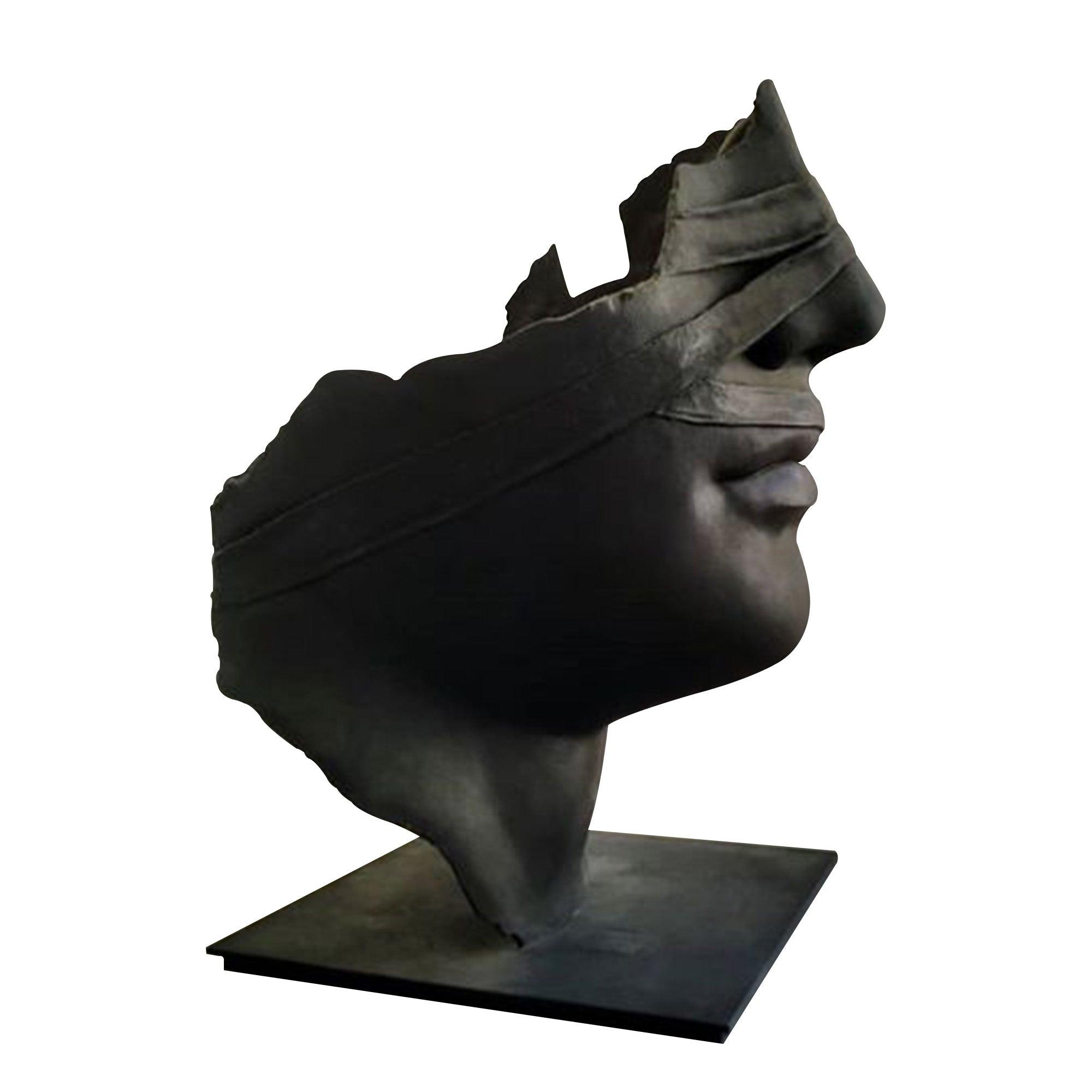 bronze broken face statue