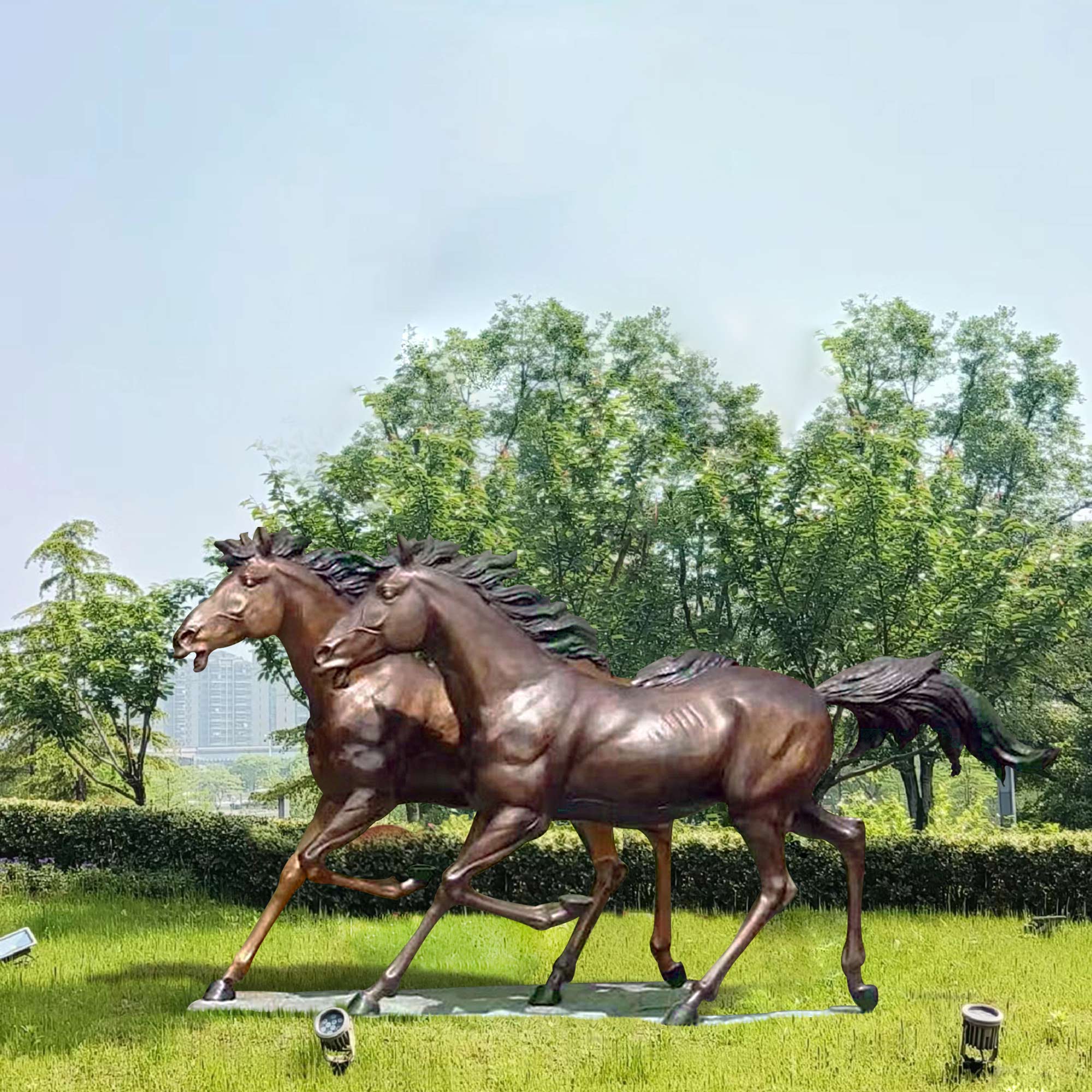 copper color two life size bronze running horse statues in garden