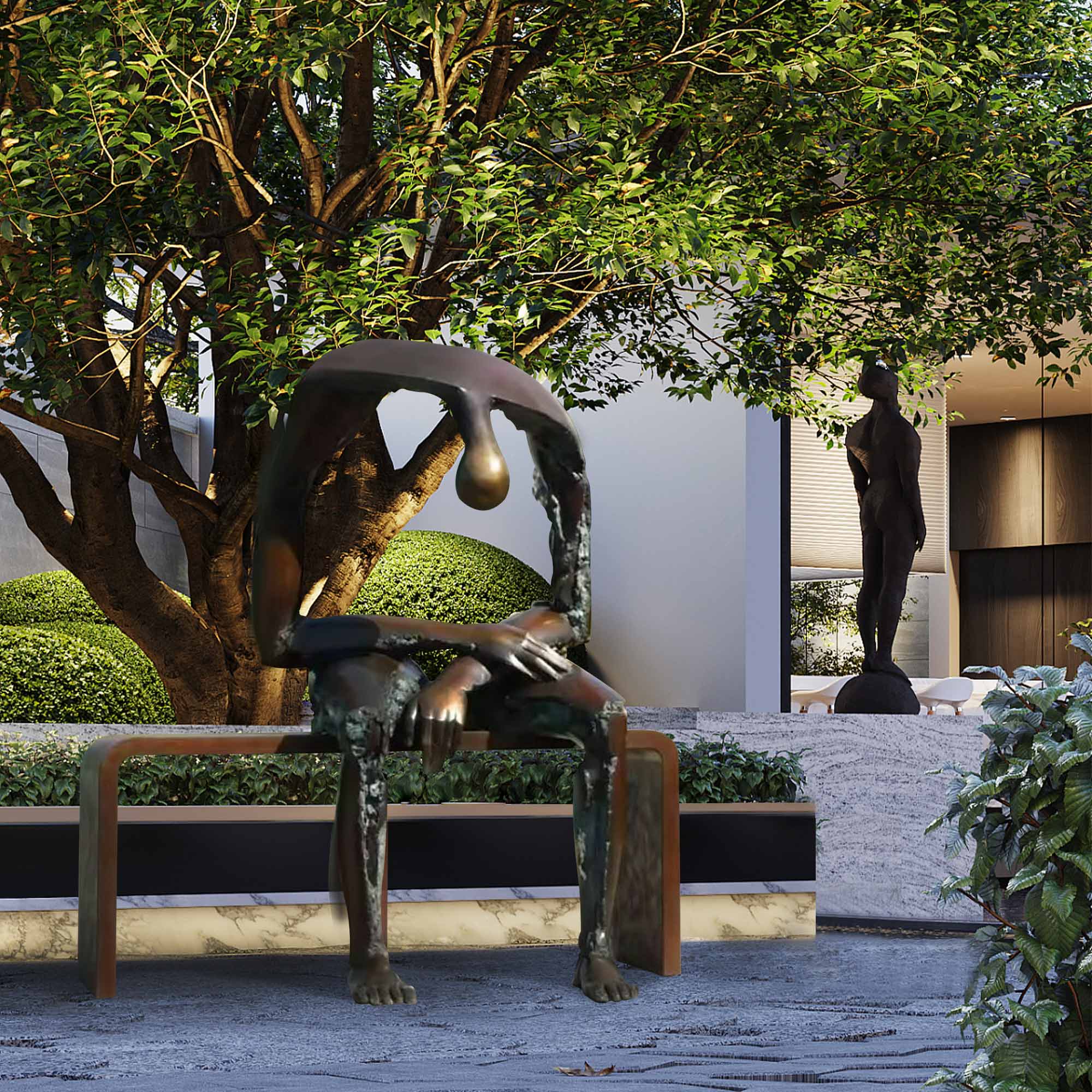 An abstract bronze sculpture of a seated figure on a minimalist bench, set in a contemporary outdoor space with lush greenery in the background