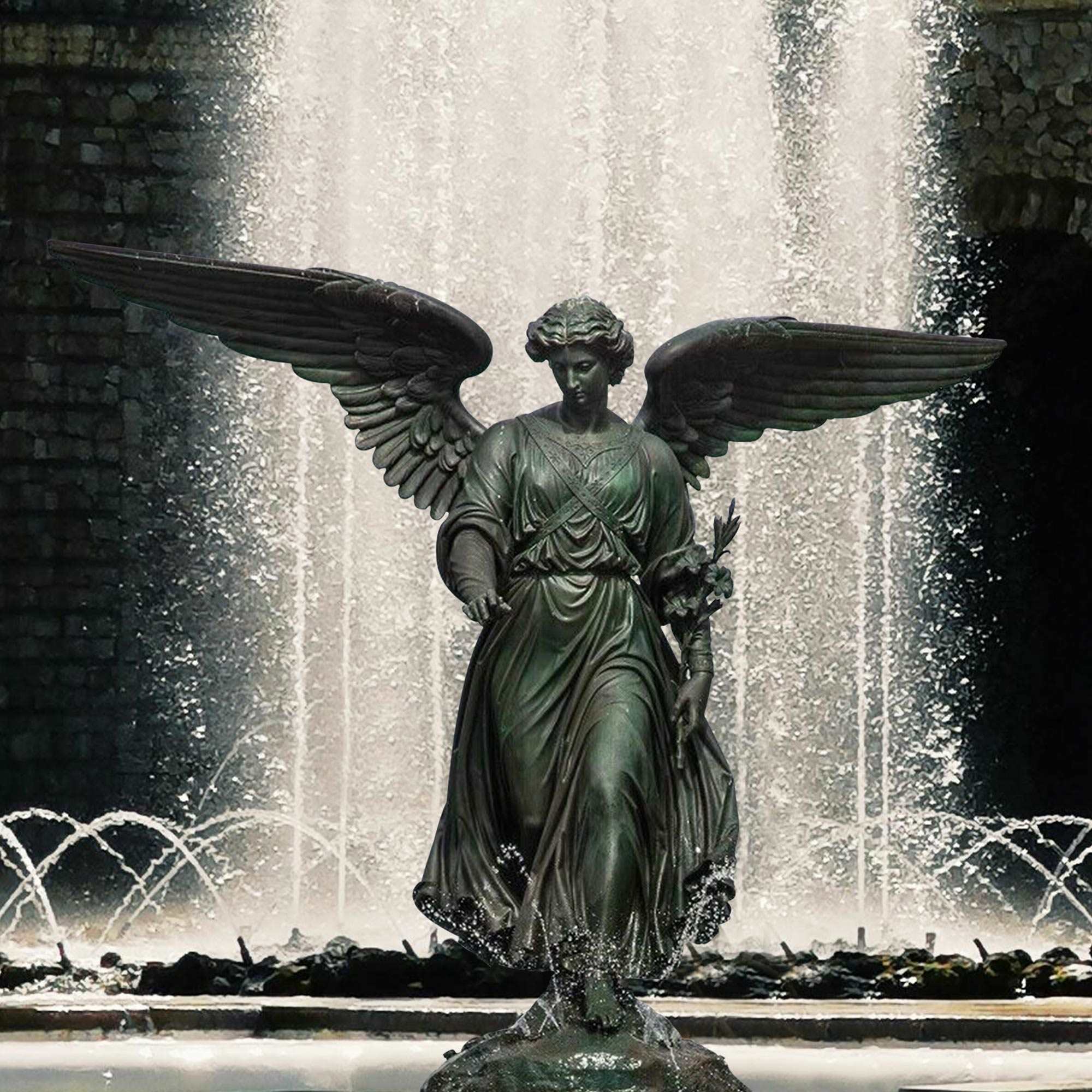 bronze bethesda fountain angel statue standing on a fountain