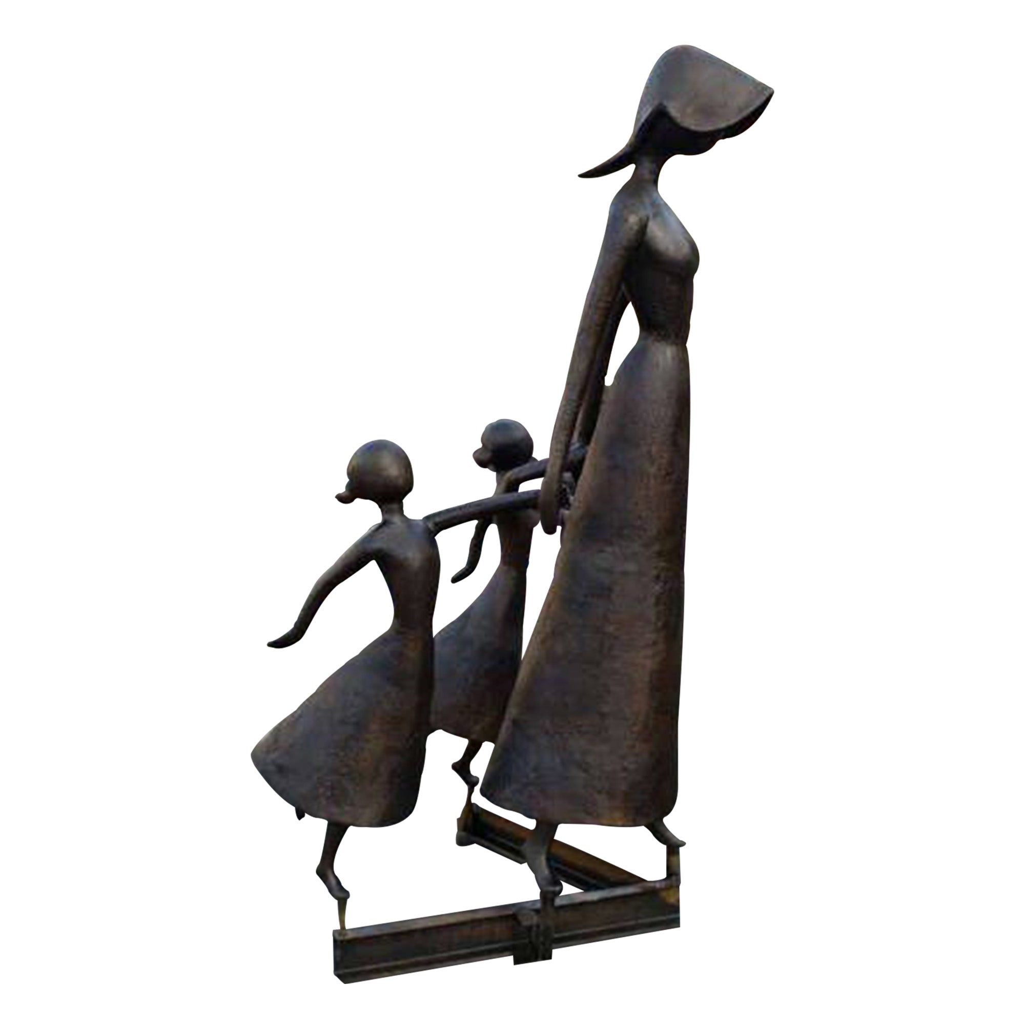 Bronze sculpture of a mother walking hand-in-hand with her two children