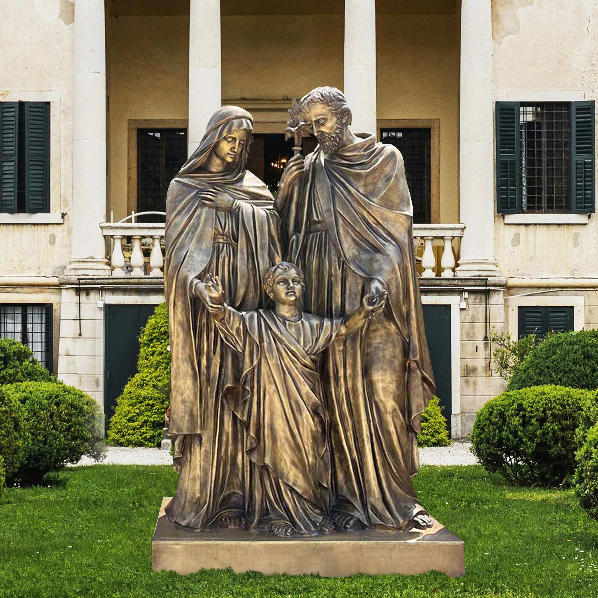 bronze holy family sculpture in garden