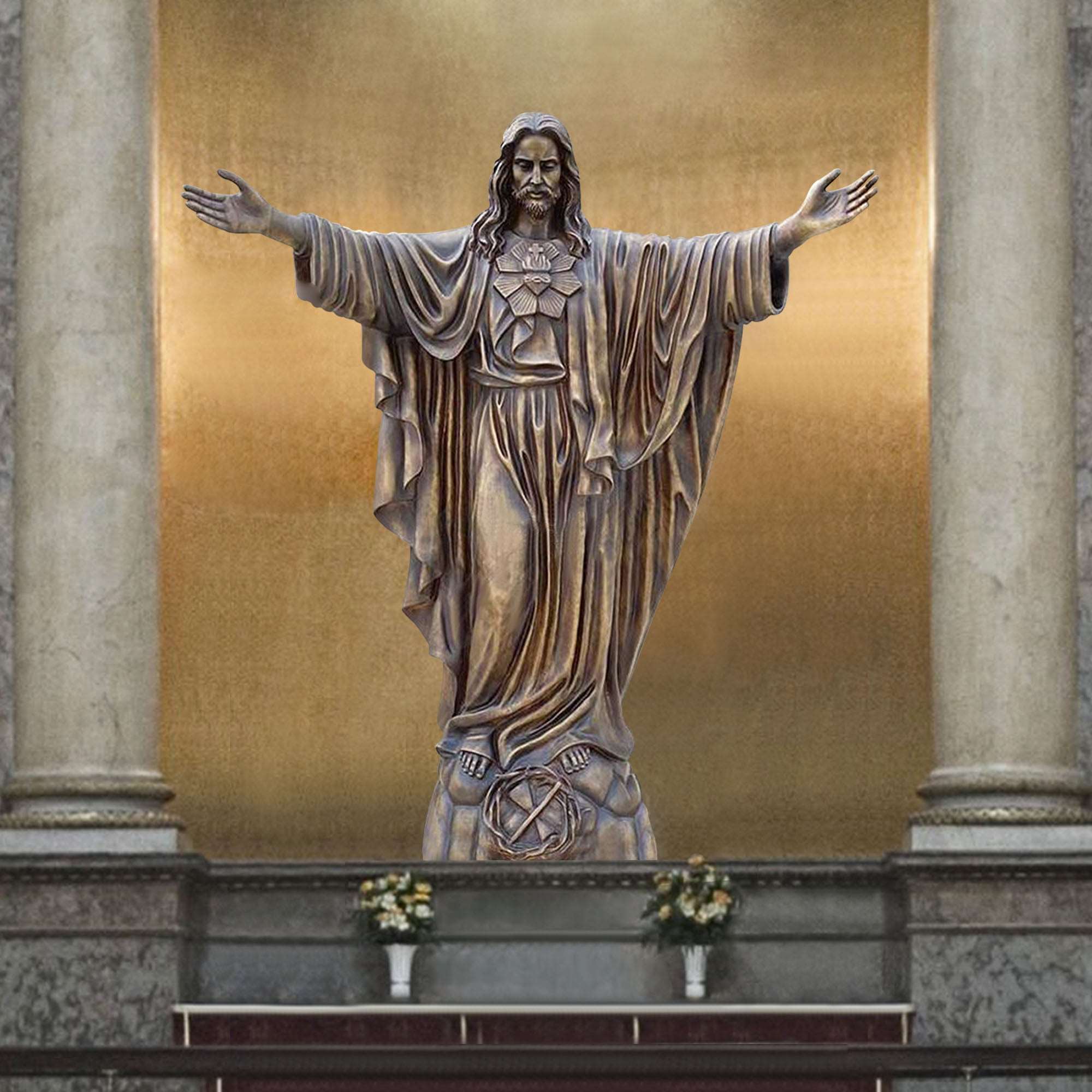 Bronze statue of Jesus Christ with outstretched arms, displayed in a religious setting with a golden backdrop.