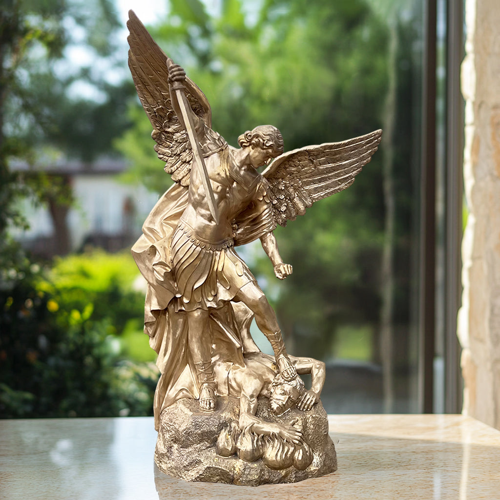 St. Michael the Archangel defender bronze statue with antique bronze finish, display in garden.