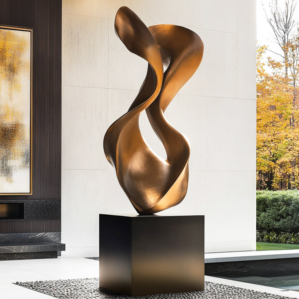 Eclipse Flow bronze abstract sculpture with twisting form and antique finish, displayed indoors with luxury modern decor.