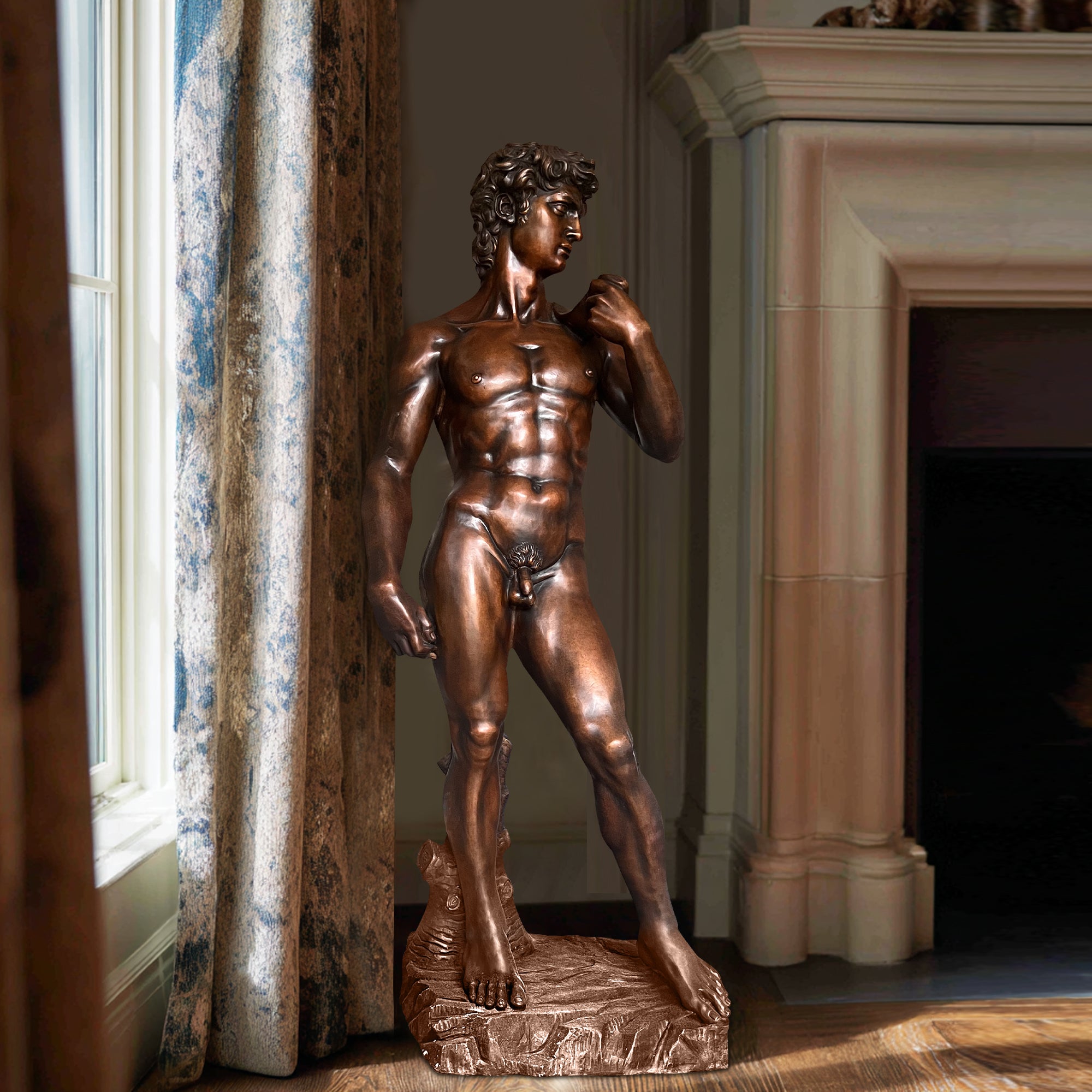 Bronze David sculpture by FINEST placed near wall in a sophisticated home interior