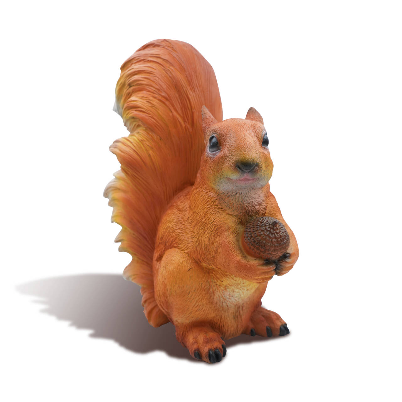 White background image of bronze squirrel statue holding an acorn, viewed from the front