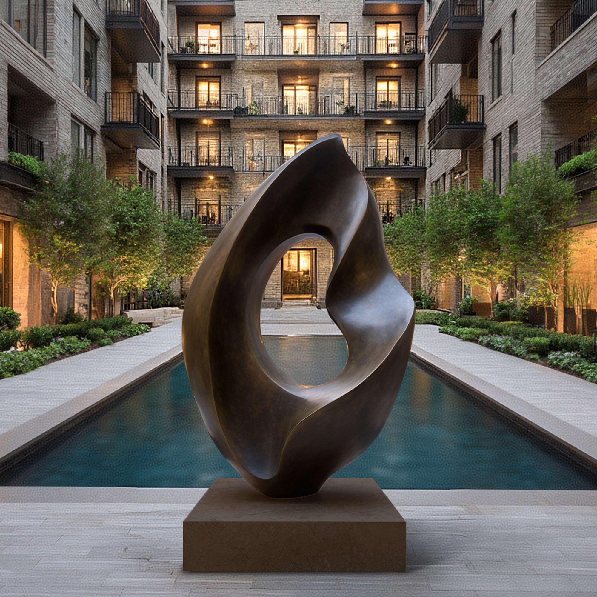 Abstract Bronze sculpture in a courtyard with modern buildings in thbackground