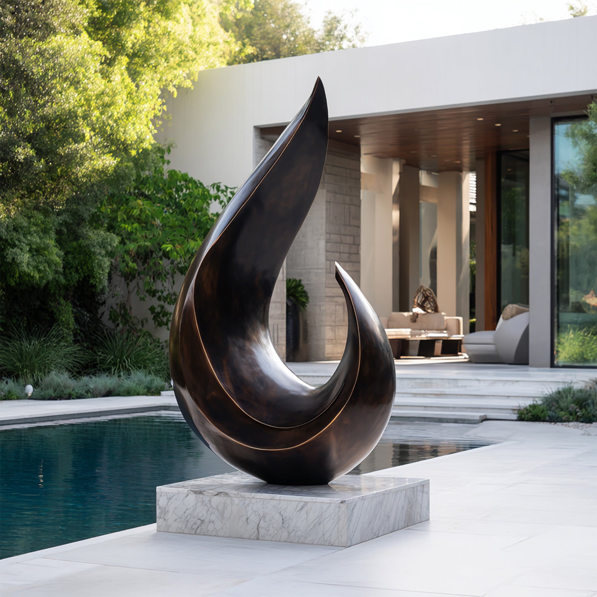 Abstract Bronze sculpture in front of a modern house with a pool