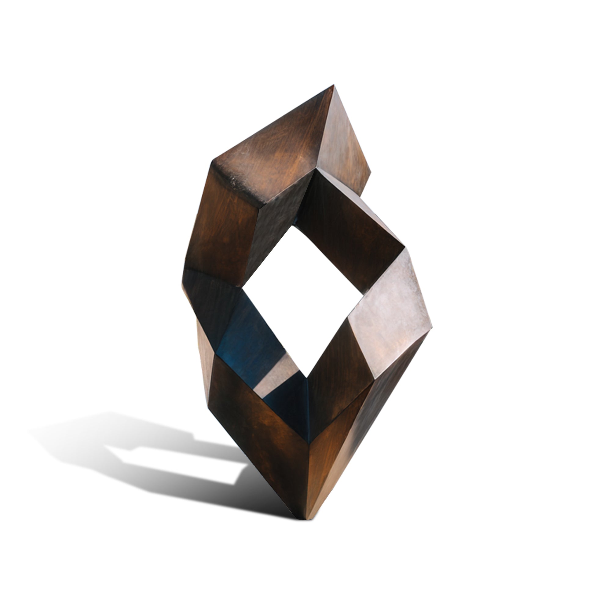 Geometric bronze abstract sculpture on a white background