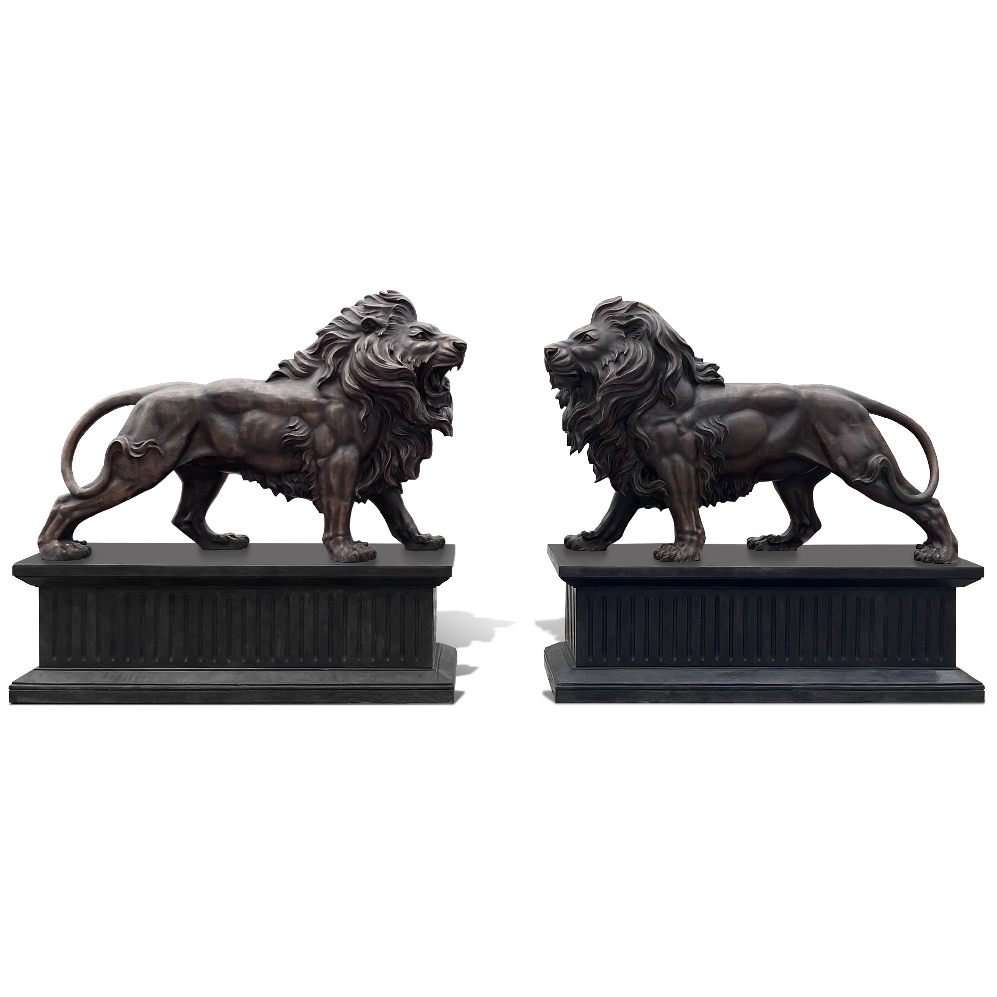 Two bronze lion statues on black bases against a white background