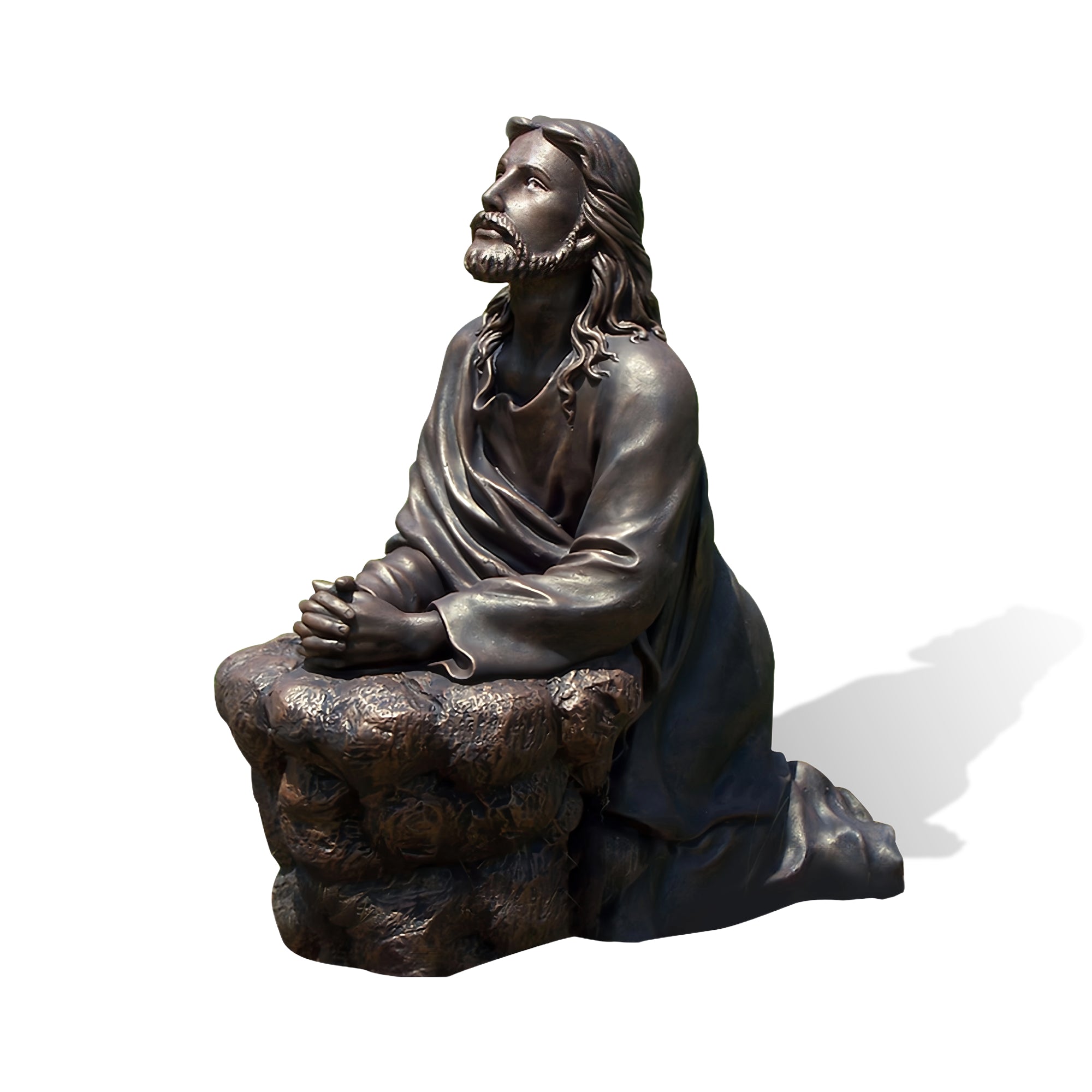 “The Prayer of Christ” Bronze statue of a seated figure on a white background