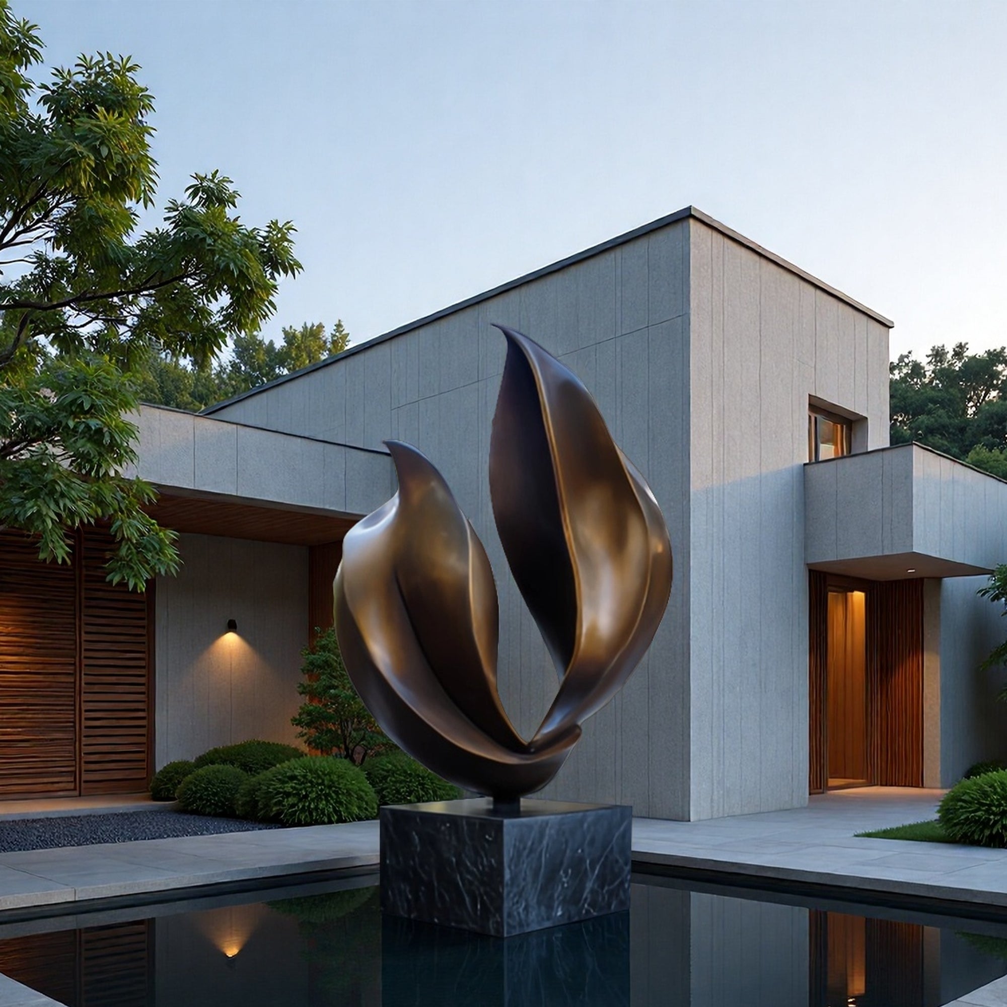 Modern bronze sculpture in front of a contemporary house with a pool