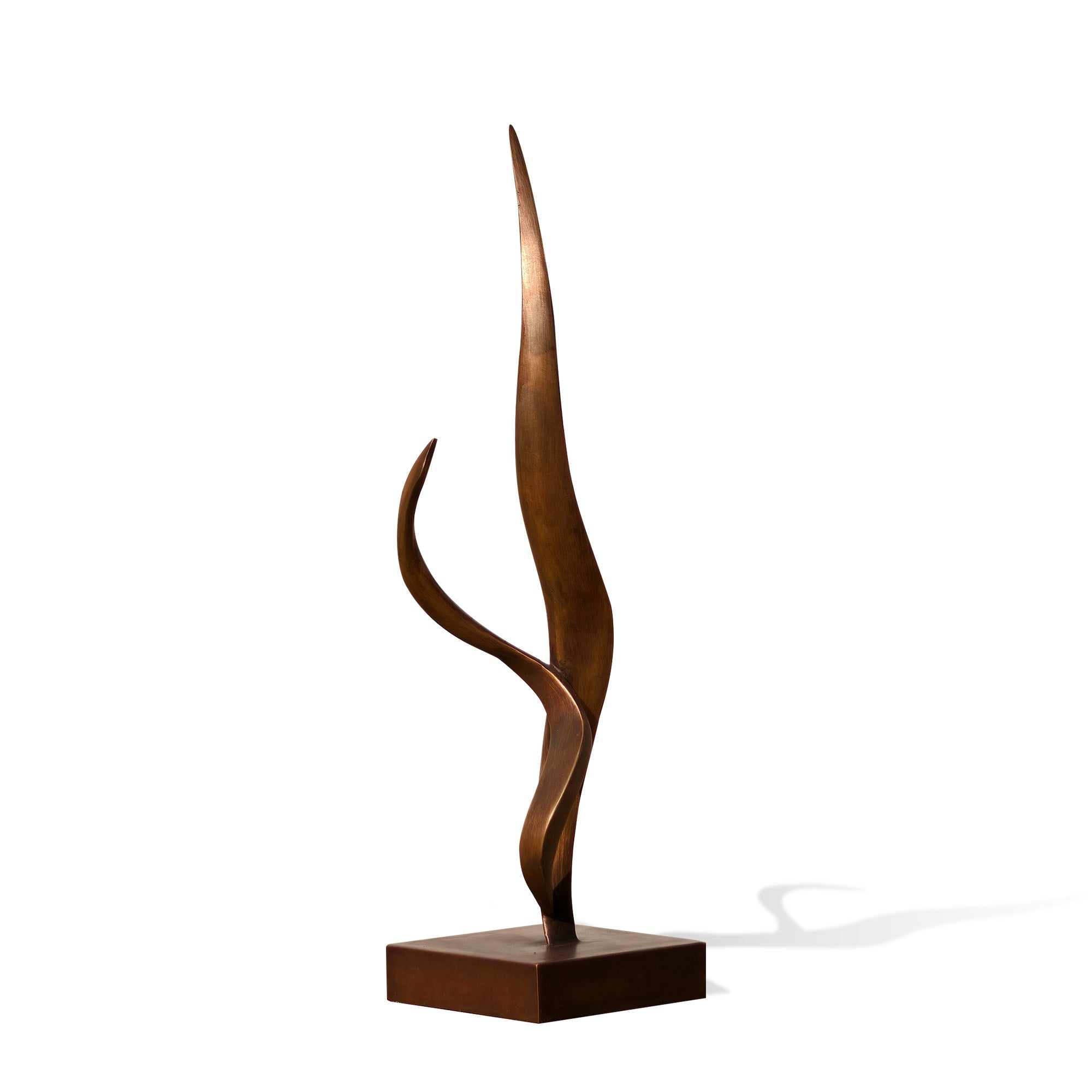 Bronze sculpture with wavy design on a white background