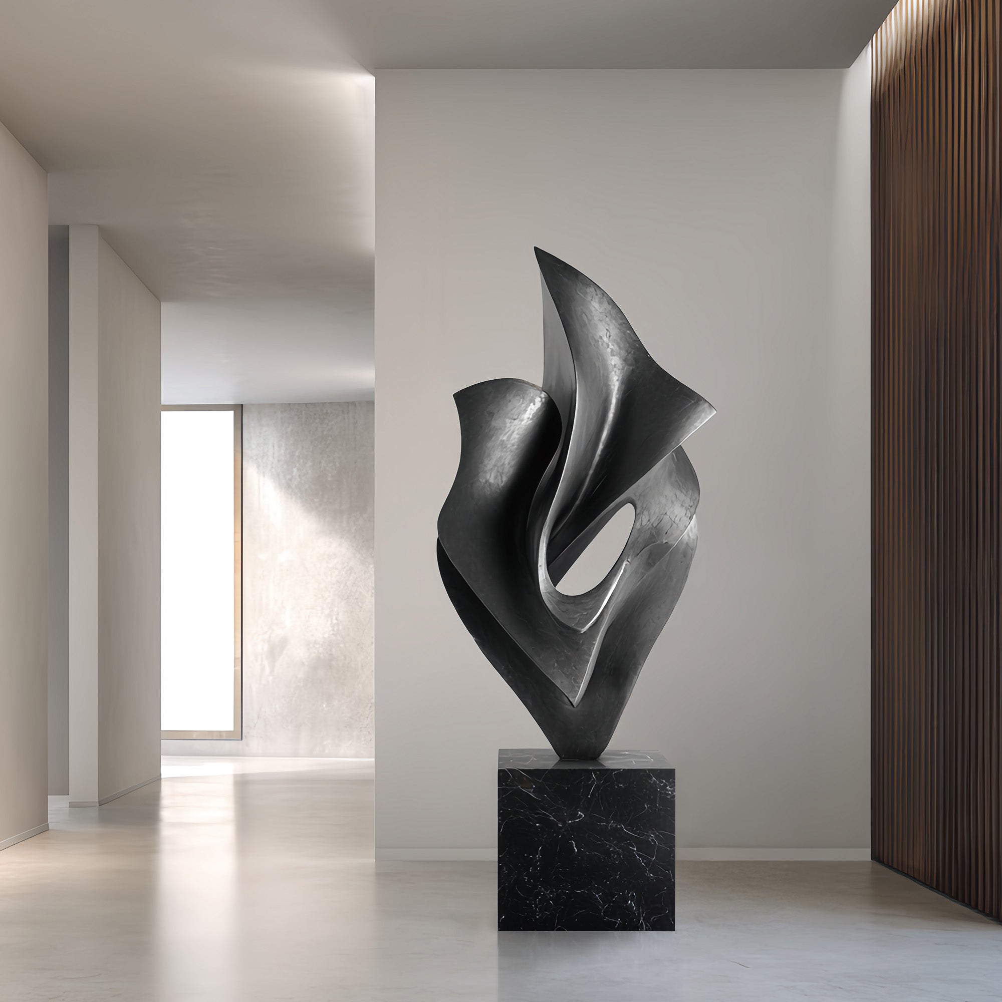 modern abstract bronze floor sculpture in black patina on marble base, displayed in a minimalist interior