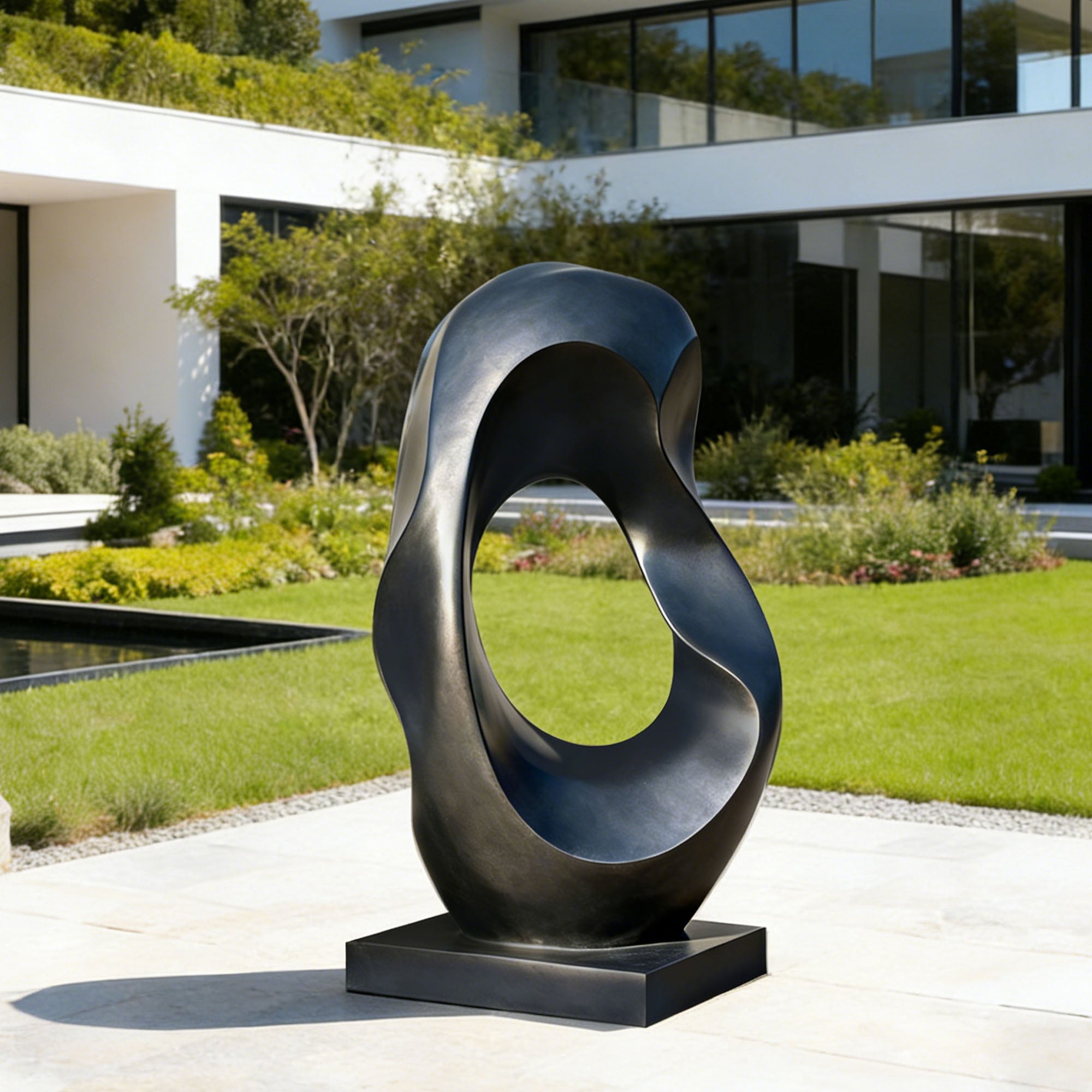 Custom bronze abstract sculpture with curved, twisting form and central void, displayed in a modern garden setting