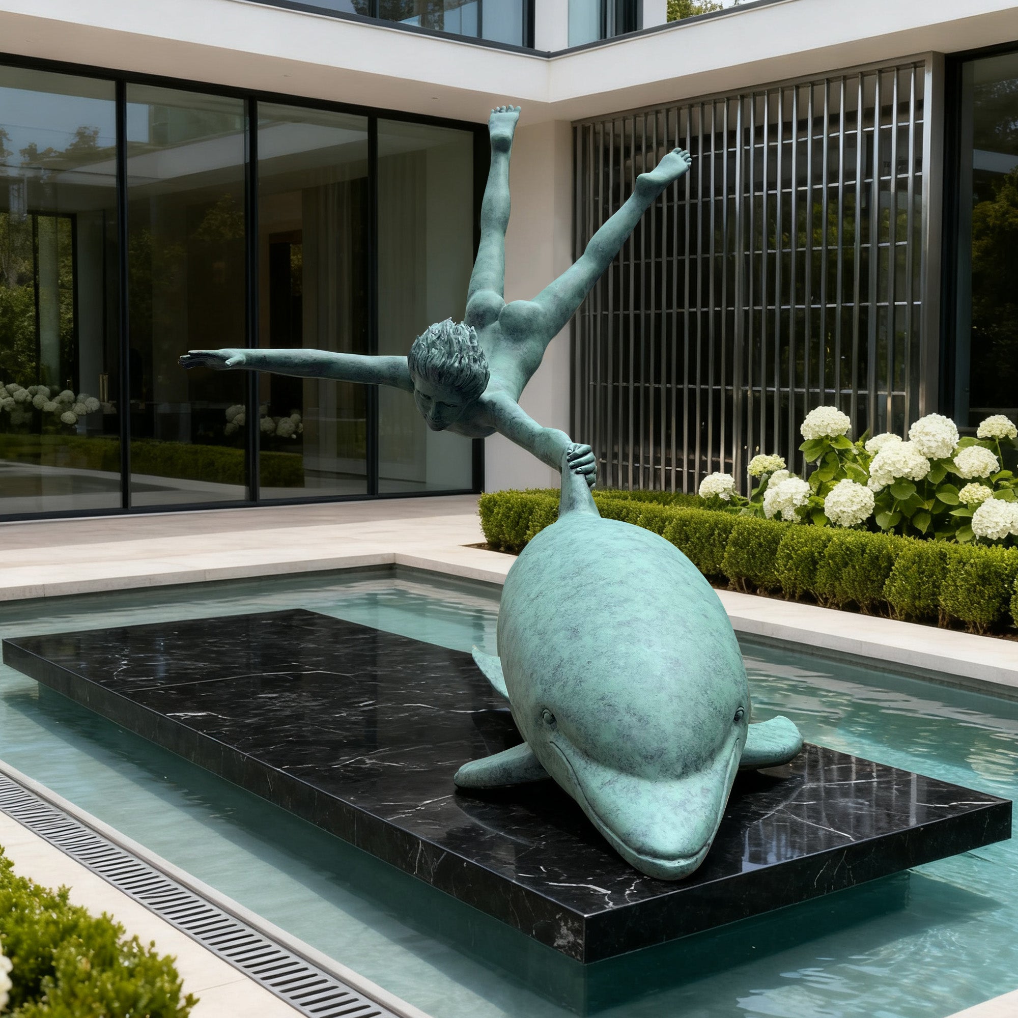Statue of a boy on a dolphin in a pool with a modern building in the background