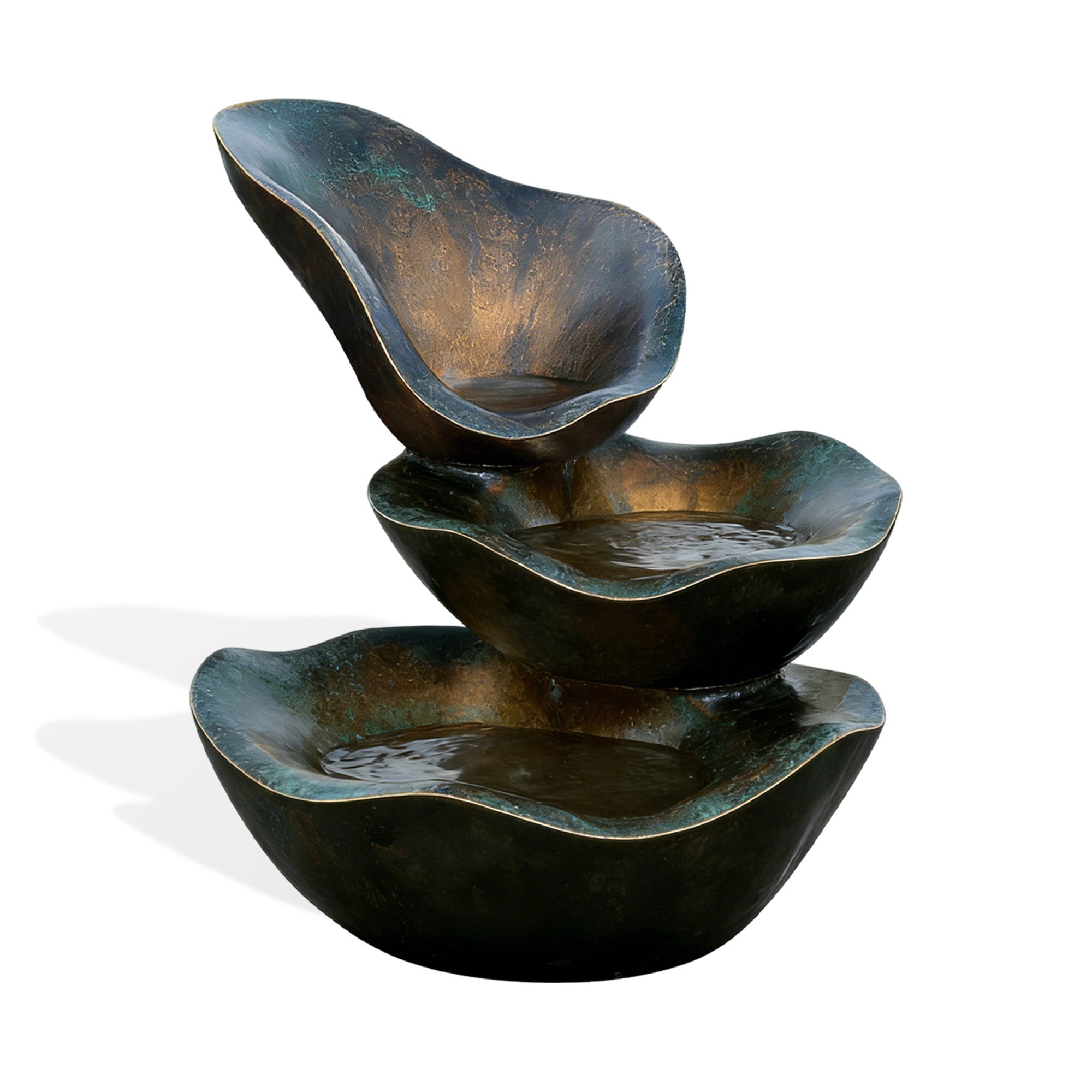 Set of three bronze bowls stacked on a white background