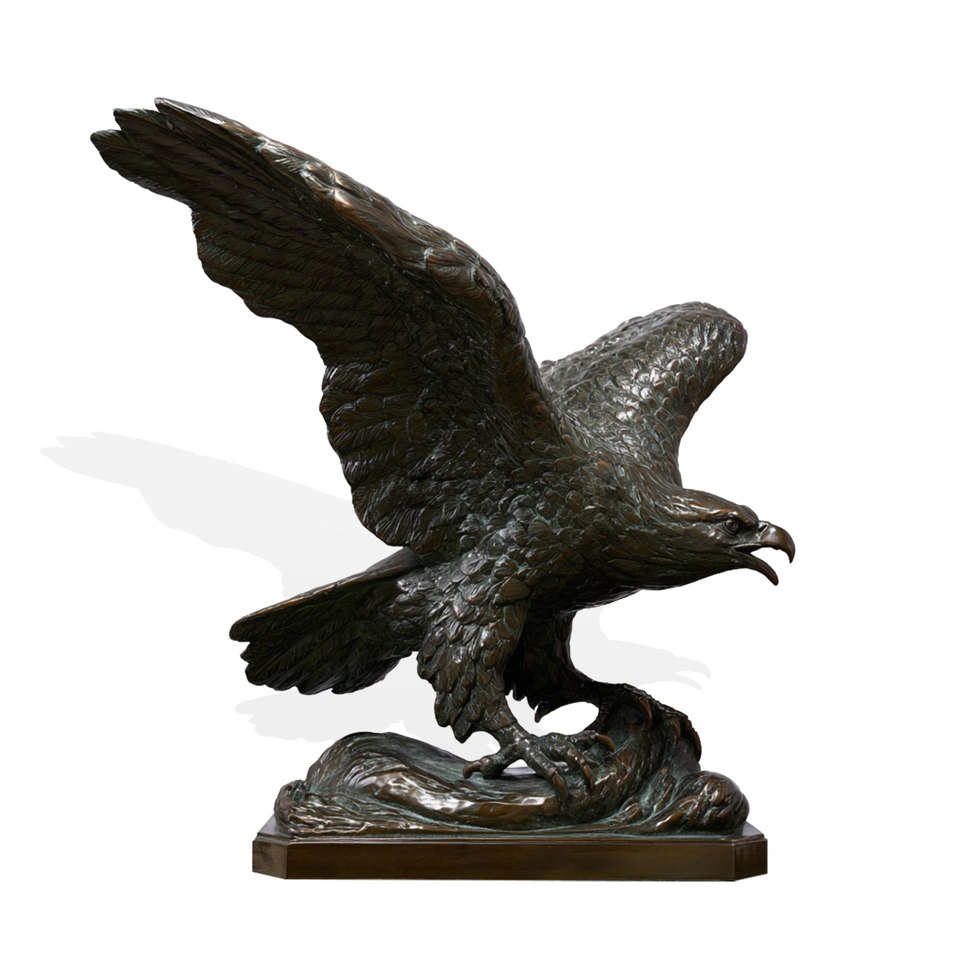 Bronze statue of an eagle with outstretched wings on a white background