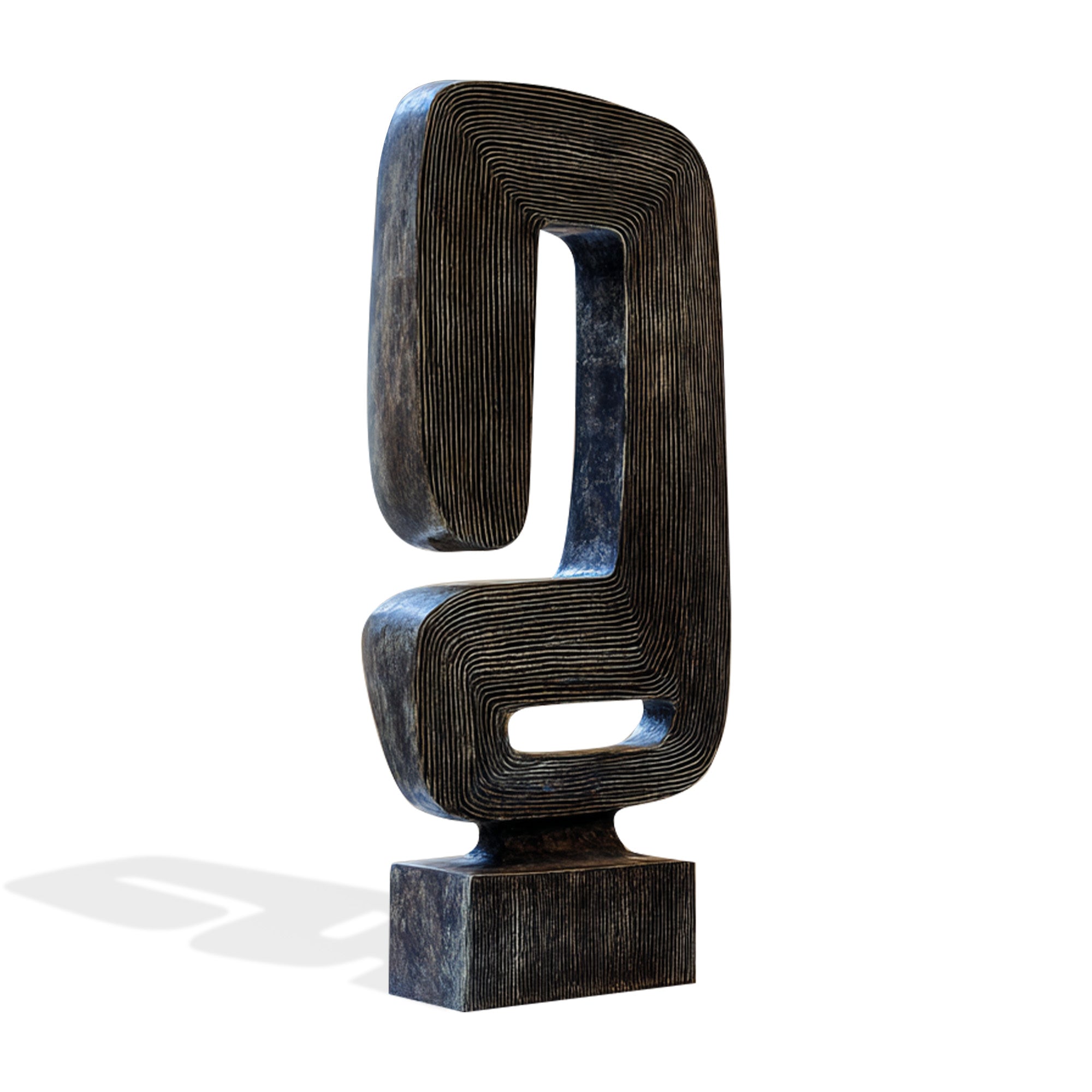 Abstract sculpture with wavy, layered design on a white background