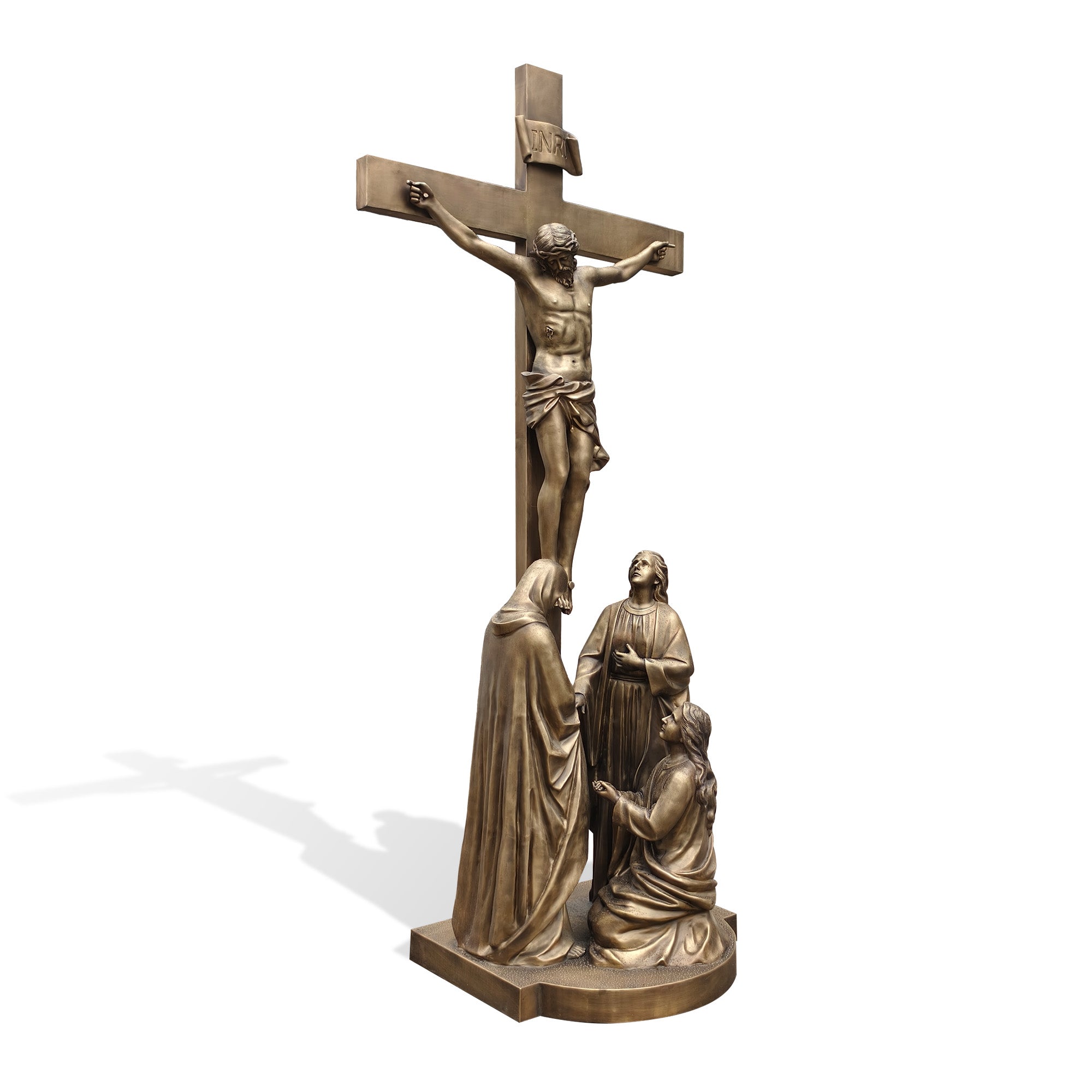 Bronze sculpture of a crucifixion scene with three figures on a white background