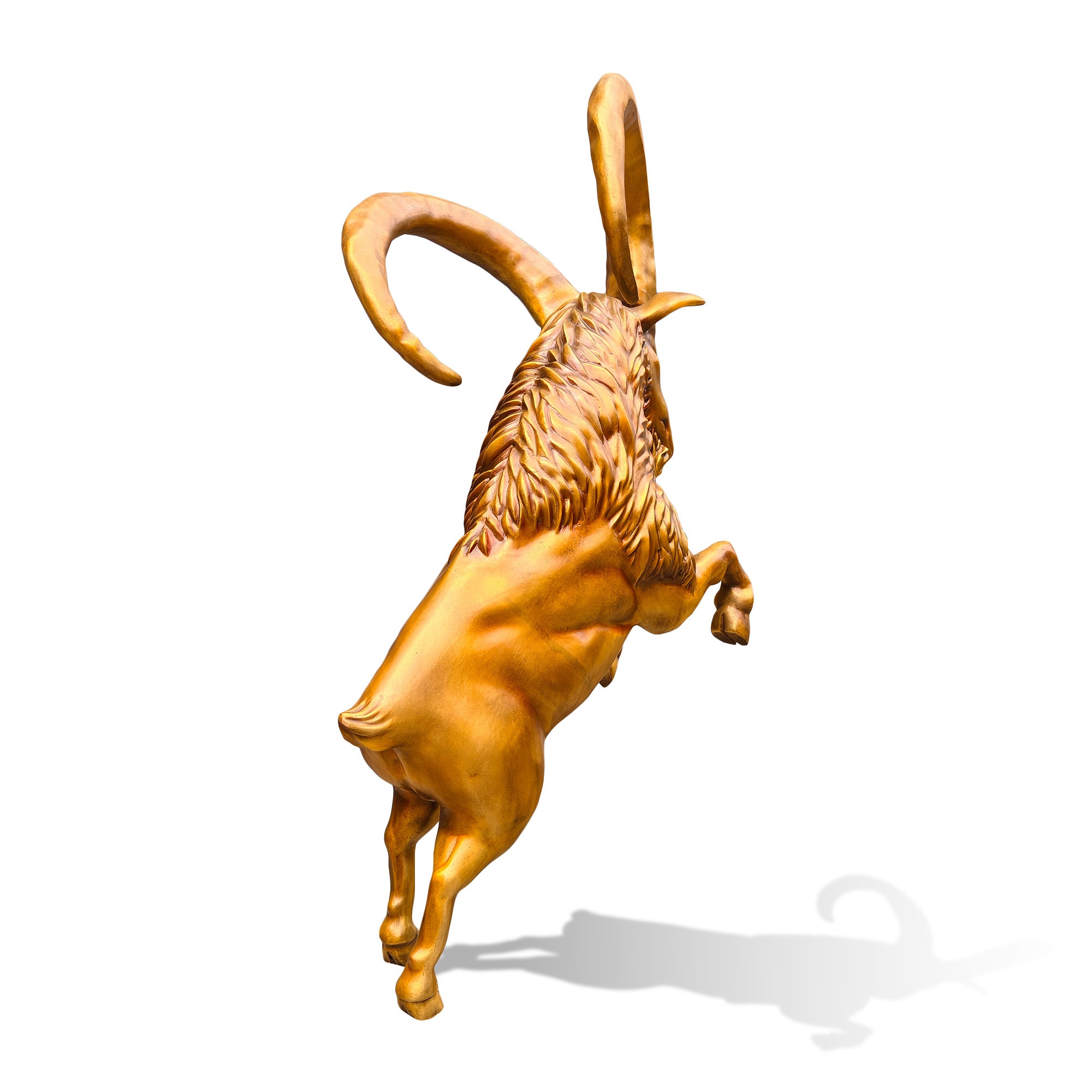 Rear three-quarter view of a golden bronze ibex statue with an upright stance, sculpted back muscles, layered neck hair, and sweeping curved horns.
