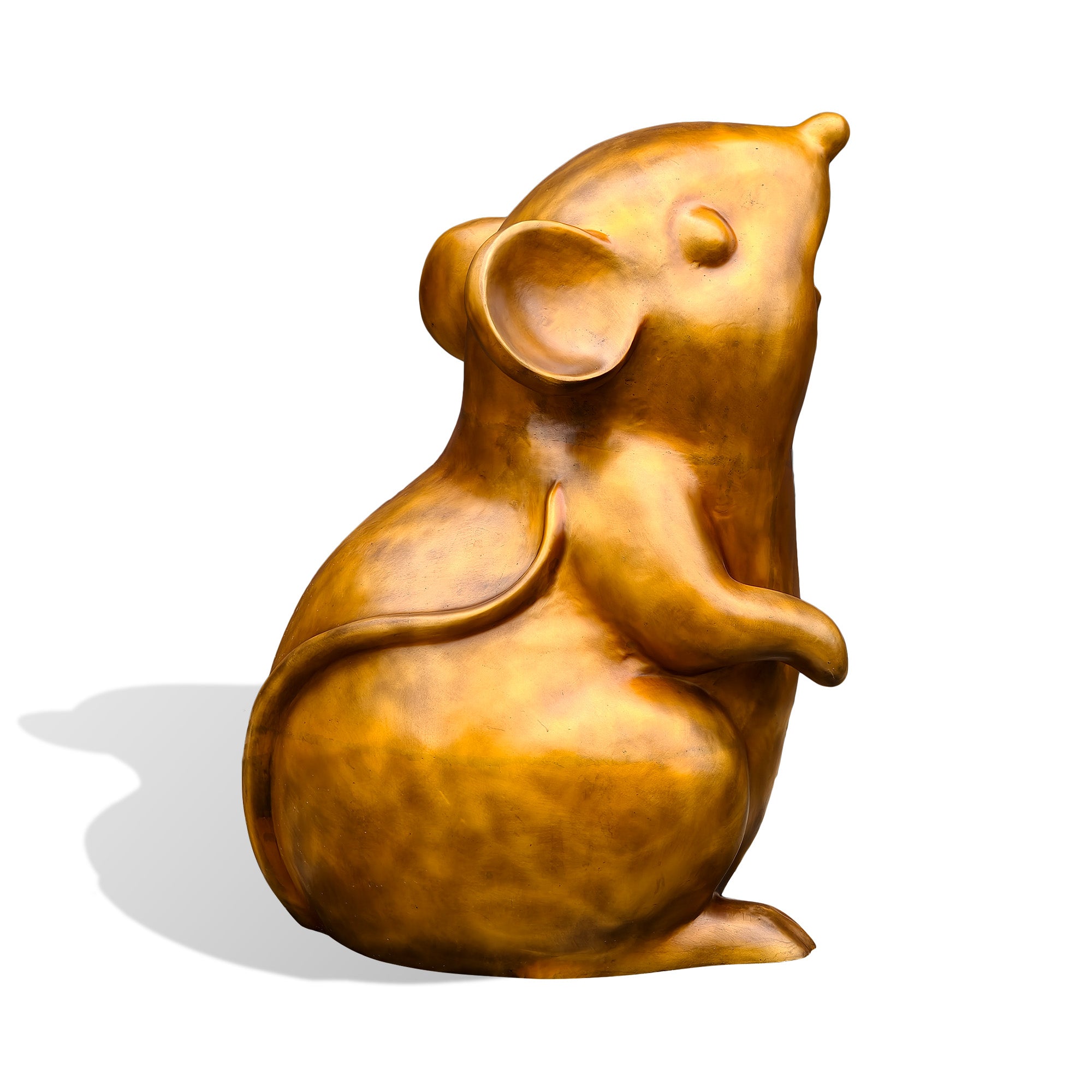 Side profile of a golden bronze mouse statue with an upward-facing head, large rounded ear, lifted front paw, curved tail, and seated body