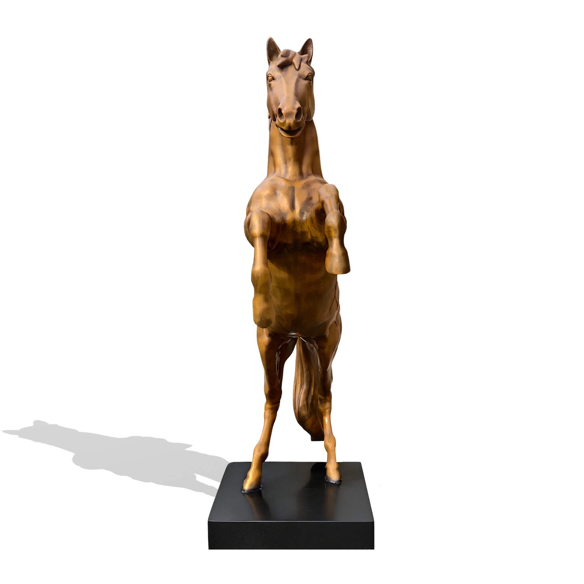 Front view of a golden bronze zodiac horse statue on a black base with lifted front hooves, upright rearing posture, expressive face, and polished bronze finish