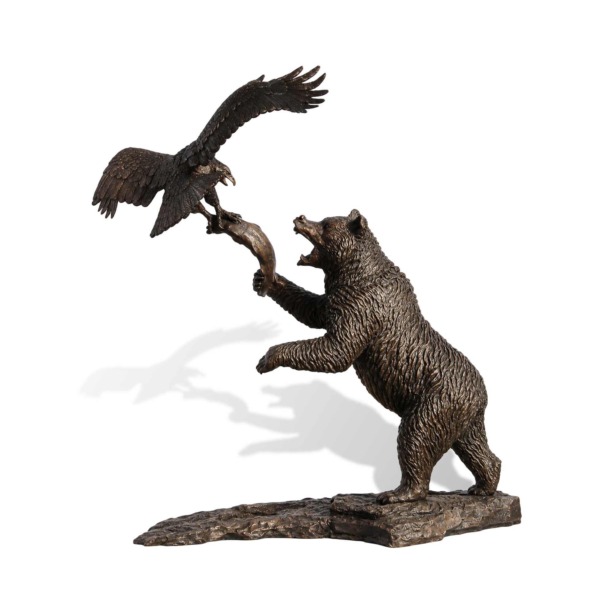 Bronze bear and eagle sculpture on a white background, showing a roaring bear reaching upward toward a flying eagle with spread wings, detailed feathers, textured fur, and rocky base.