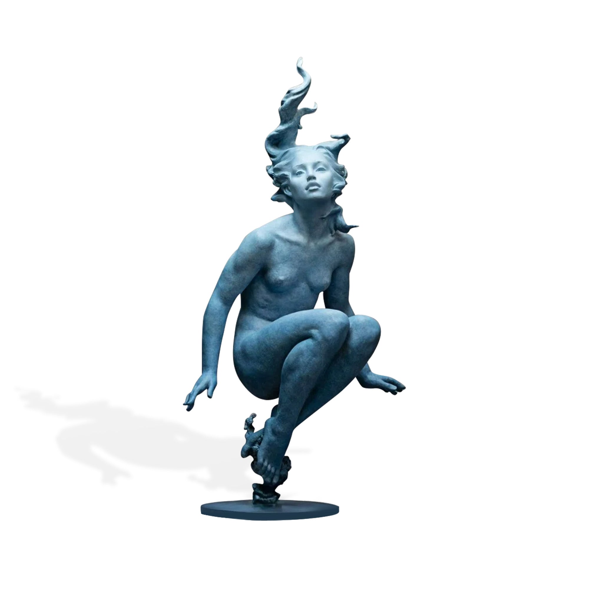 Modern bronze female figure sculpture with blue patina finish, floating seated posture, expressive face, flowing hair, and round base on white background